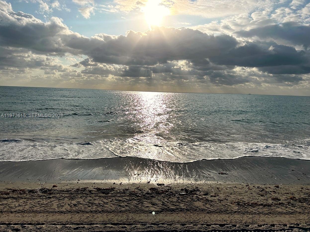 Commanding breathtaking Atlantic vistas from its privileged eighth-floor setting at Grand Bay Tower, this exceptional residence is a rare offering on the island of Key Biscayne. Originally conceived as a three-bedroom, five-and-a-half-bath home, it has been masterfully reimagined into a grand two-bedroom, three-and-a-half-bath layout, enhancing scale and flow for refined entertaining and effortless daily living. With approximately 3,950sf, the expansive living and dining areas, a secluded family room, and a bright kitchen with breakfast area are complemented by three terraces totaling about 595sf that are seamlessly integrated throughout the residence. Custom woodwork by renowned designer Juan Montoya enriches the interiors, while the serene primary suite offers bespoke closets and a spa-inspired bath, completing this exceptional oceanfront retreat. One storage unit is included. Separate guest quarters and an additional storage unit are available for purchase separately.