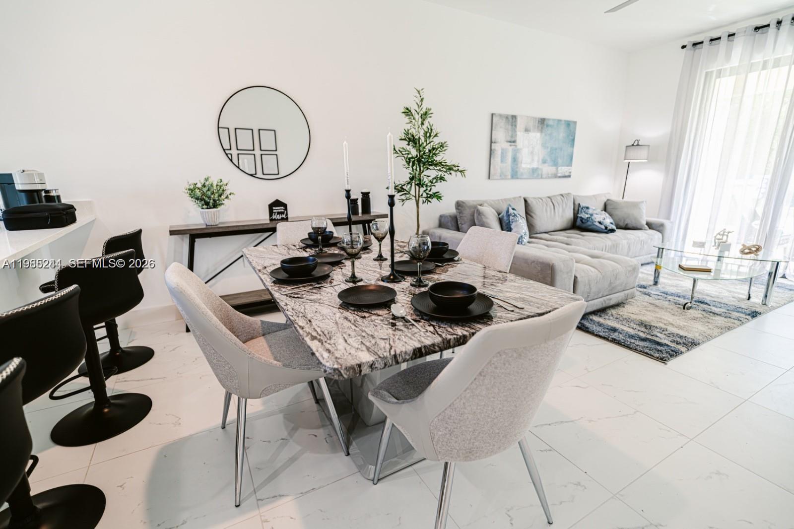 Open-concept living area at 434/436 Bell - Home in Lehigh Acres