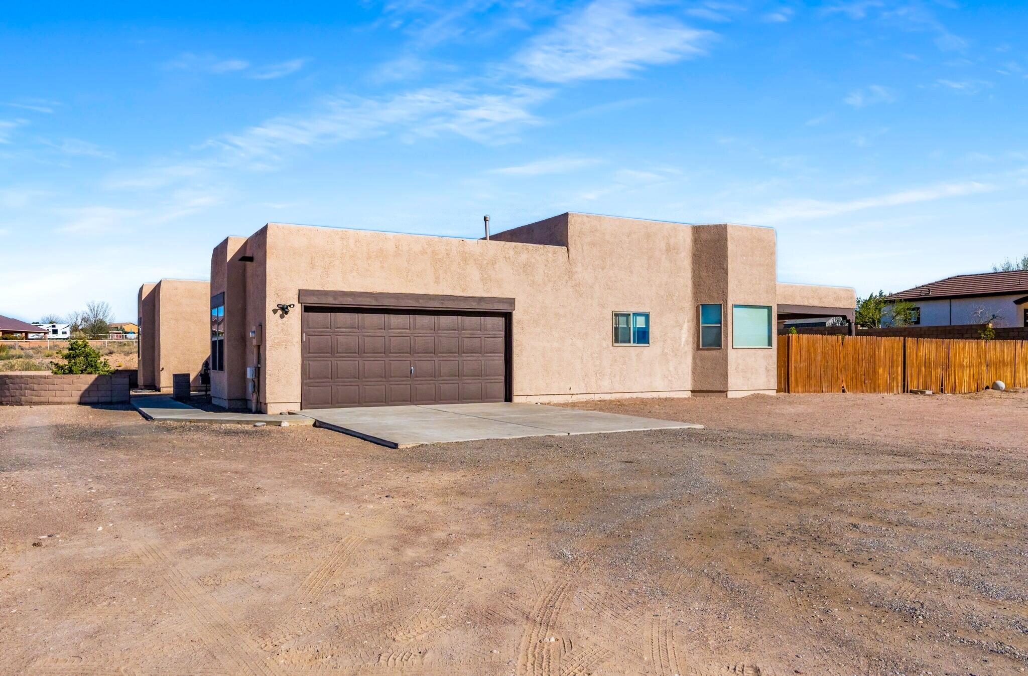 Breathtaking Sandia Mountain Views await just outside this 4 bed 3 bath home located in the Rio Rancho Estates Subdivision! This updated single-story 2,300 sq ft home has modern amenities such as an open floor plan, large master suite with spacious walk-in closet, garden tub, his and her double sinks, newer tile flooring throughout, and newer refrigerated cooling unit. The gourmet chef's kitchen has newer appliances, granite countertops, updated backsplash, & a breakfast nook overlooking the spacious living area. This home on 1 acre has ample room for RV parking. Enjoy the outdoor sitting area under the covered patio. This home is in an ideal location with nearby restaurants (The Local Brewhouse, Blakes, Dions, etc) and shopping (Walmart, Target, Walgreens, Lowe's Home Improvement, etc).