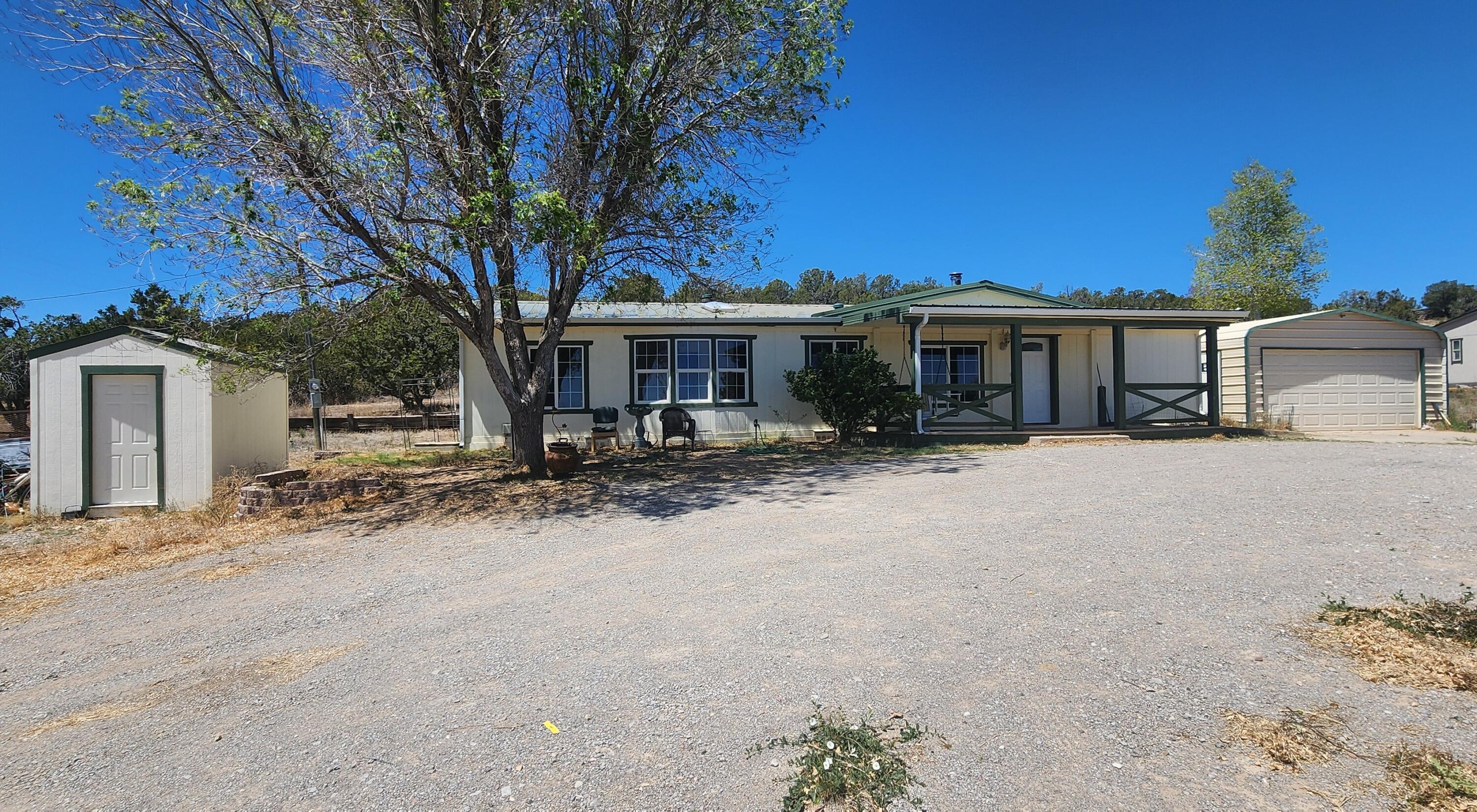 Move- In Ready Beautiful manufactured home, a great floor plan , new interior paint, Excellent location near by I-40, 30 minutes to Albuquerque  you need to see this property to appreciate it  Fully fenced and gated with Community water.