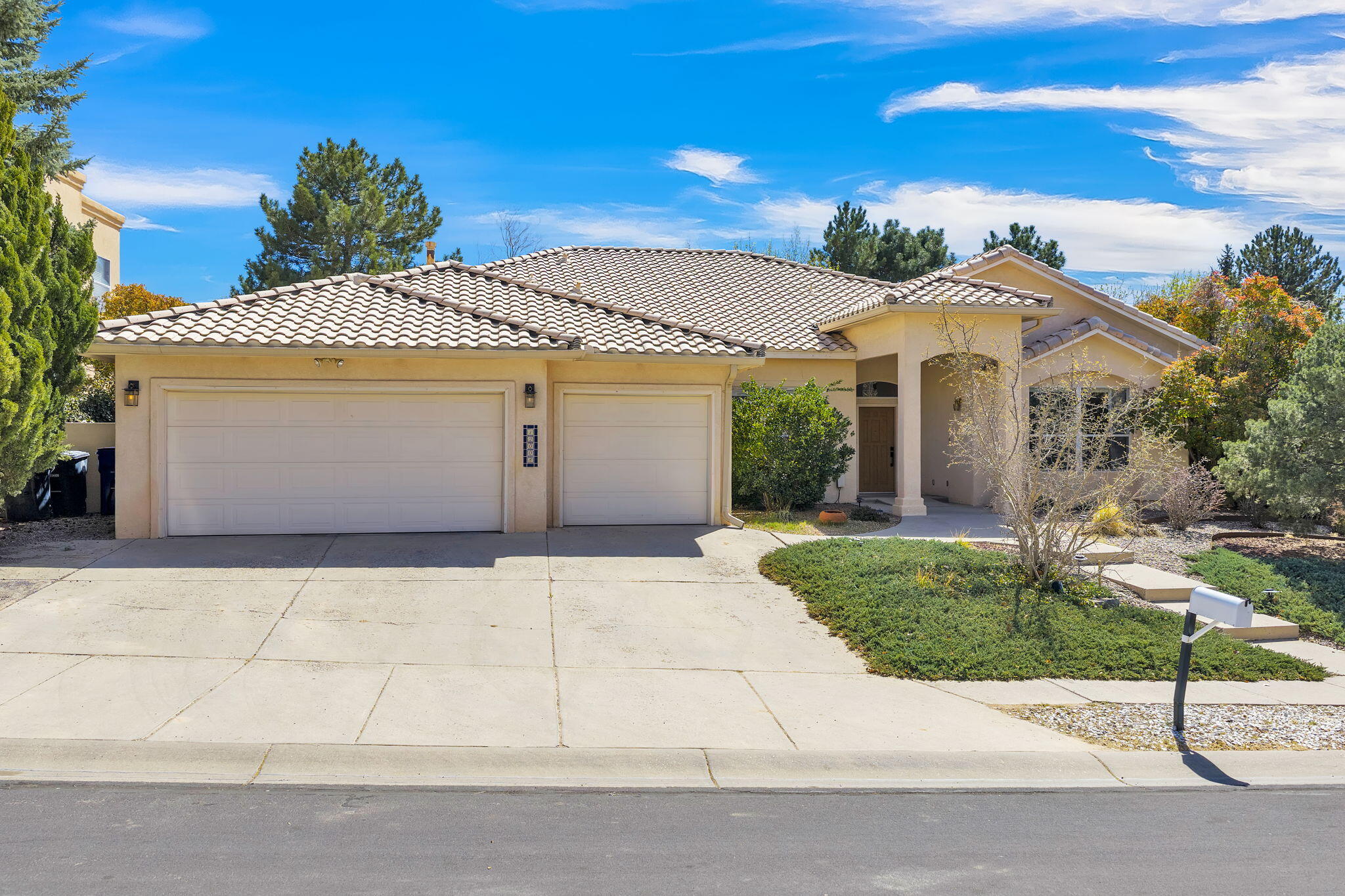 If you're looking for the elusive 6 bedroom home in a magical neighborhood surrounded by mature growth trees, mountain views, and greenery, this home is a perfect match! An all single story, ADA compliant home with a 3 car garage, open living area and fully enclosed patio is a rarity. The primary bedroom suite is truly a suite, with a spacious walk-in closet, soaking tub, separate shower, and dual vanity. You'll love the gas fireplace in the spacious living room! Granite countertops in all bathrooms and in the kitchen.Recently freshly painted and refreshed with new kitchen appliances, and new carpeting in every bedroom!The back yard feels like a sanctuary, with mature, flowering trees and a wall of vines, without requiring much upkeep.