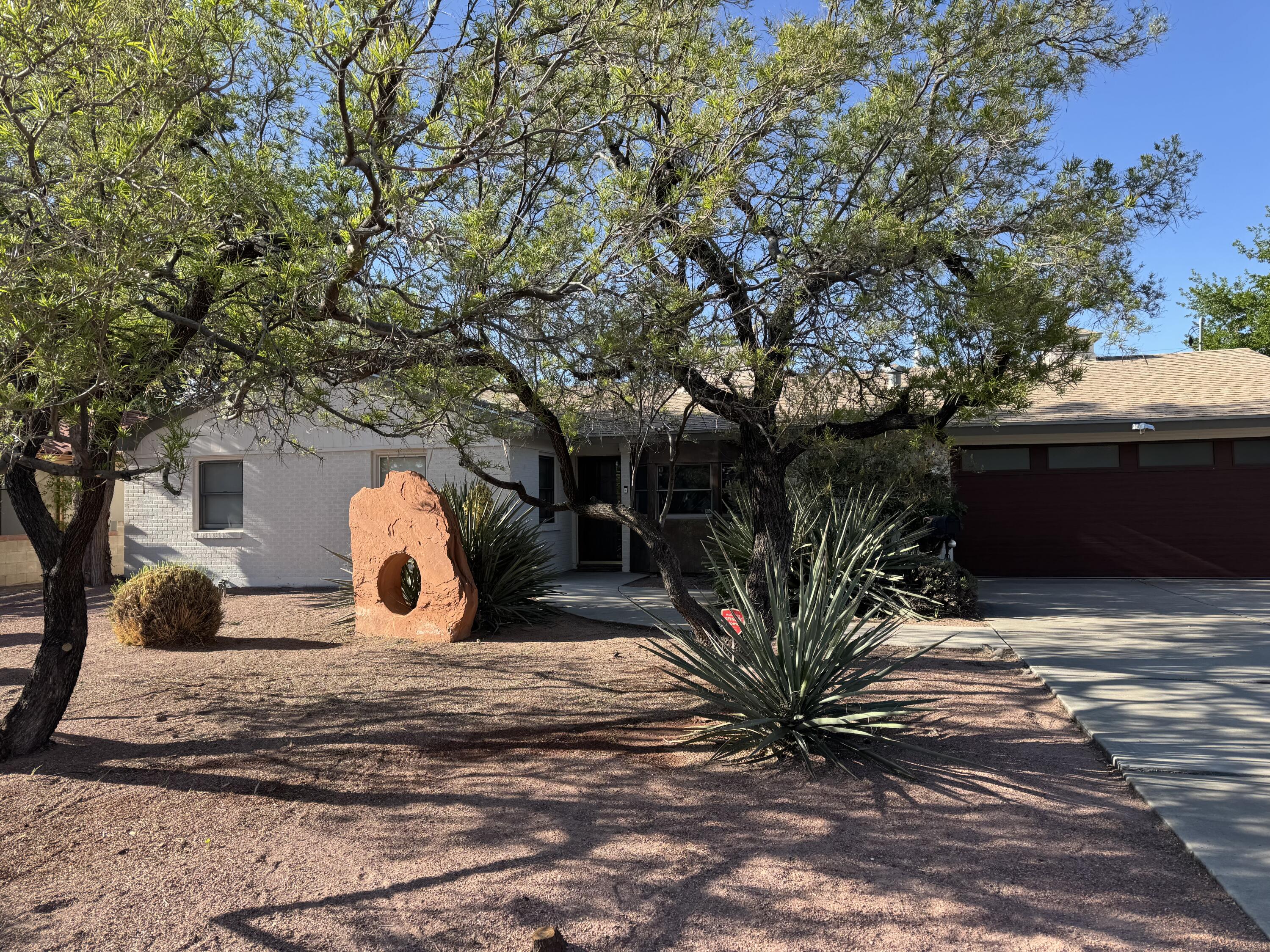 Great opportunity to live in the coveted Albuquerque Country Club neighborhood surrounded by trees and parks. This lovely white brick home has great space and large windows. 3 bedrooms, 2 baths, Fireplaces in the living room and dining room. 2 car garage. Nice size yard with plenty of space for a pool. Great Home for Entertaining please come see it today.  Professionally Staged. NO HOA fees.