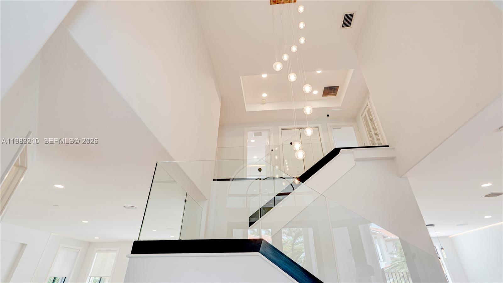 Completely renovated luxury home with high-end finishes, designer details, premium smart-home features throughout. This exceptional residence offers a modern, light-filled design w/everything completely new, combining contemporary elegance with comfort, functionality and resort-style outdoor living. Main Features are:Fully newly renovated with luxury finishes & equipment throughout; Bright, modern interior with light tones & warm wood accents; Waterproof luxury vinyl flooring; Contemporary glass staircase; In-ceiling ambient LED light strips in every room; In-ceiling speaker installation; Kasa smart dimmer switches throughout the home, controllable via Alexa; Separate guest house w/ private bathroom; Beautiful pool area w/ lush tropical landscaping; Tikki Hut tropical patio lounge; Designer kitchen w/ premium finishes & thoughtful custom details: Thick marble countertops; Light-color palette with elegant wood elements; Large kitchen island w/ integrated LED lighting; Induction cooktop with hood; Soft-close cabinetry throughout w/ BLUM hinges; High-end interior cabinet drawer organization for cutlery, spices & more; LED-lit shelving; Wine cooler; Luxury bar sink with premium accessories, including waterfall faucet, cutting board; Spacious pantry w/ ample storage & Motion-sensor shelf lighting, all bathrooms have Floating vanities- Primary has double; LED vanity mirrors; Marble showers w/ floating glass enclosures; Smart toilets w/heated seats & automatic flush. MUST SEE!