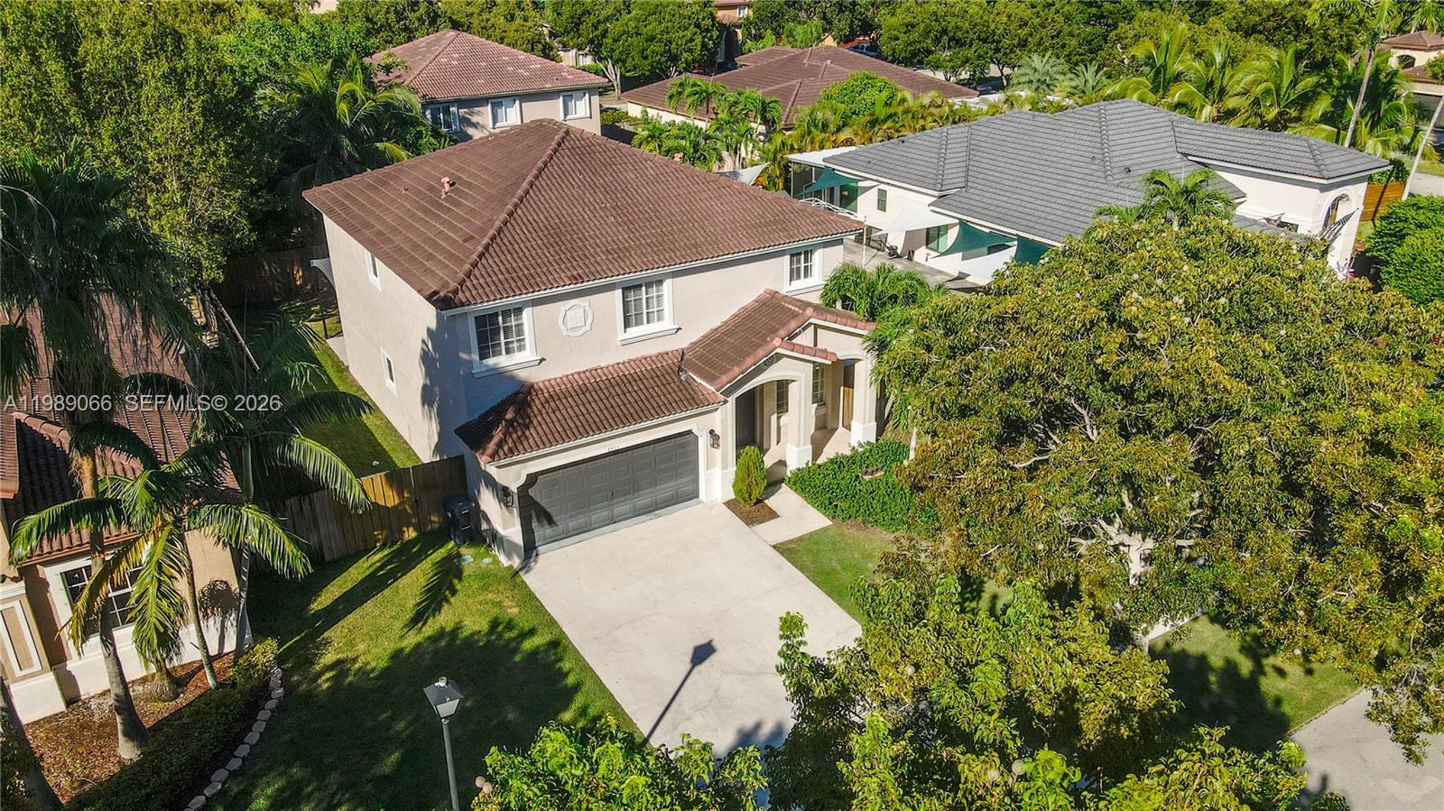 This immaculate 4-bed/2-bath/1-car home is one of the cleanest on the market. Meticulously maintained with numerous upgrades completed when the owners moved in. Wood-look ceramic tile flows throughout the downstairs, and laminate wood upstairs. Each bedroom offers generous space and excellent closets. The oversized primary suite includes a sitting area, room for a king bed, a large walk-in closet, and an additional hall closet leading to the master bath. The covered patio spans the length of the house, and a side parking pad with double gates and a wood fence enclosure provides RV/boat parking. An impact French door opens to the covered patio. The kitchen features high-end stainless-steel appliances, and a washer/dryer is conveniently located across from the half bath off the family room. Move-in ready.