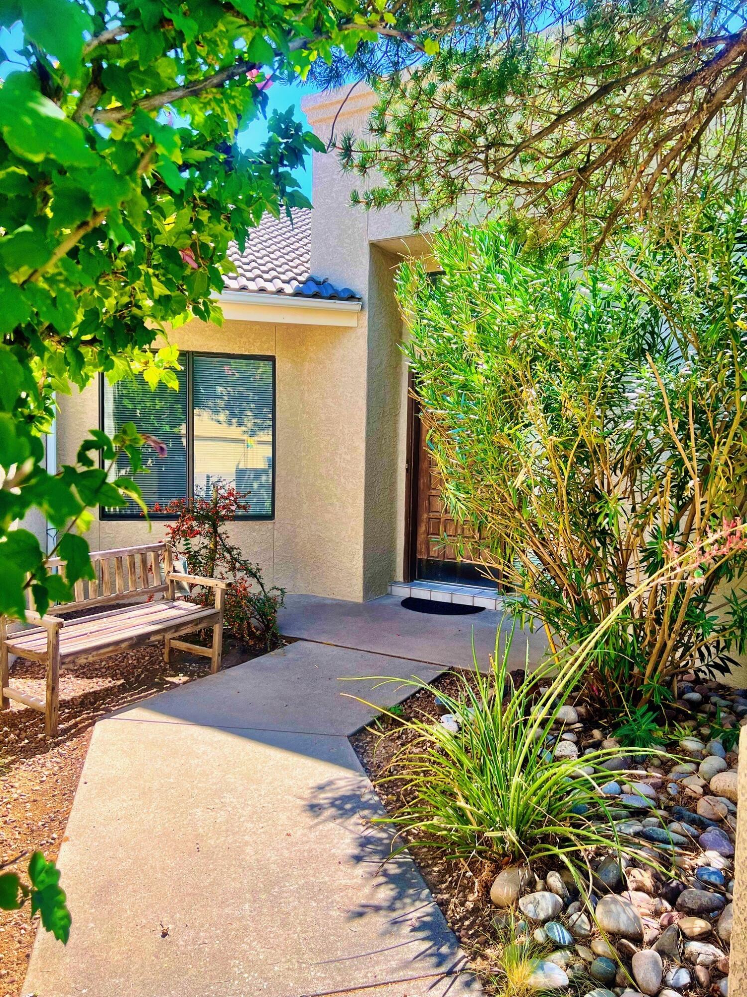 Welcome to this Inman home in highly sought-after Canyon Run Subdivision! This spacious residence offers Two inviting Living Areas, Four comfortable bedrooms. Enjoy raised ceilings, dramatic skylights, a cozy fireplace, a retro/ stylish wet bar, and a two-car garage for added convenience. Both the front courtyard and backyard are designed for easy maintenance, and the backyard is a private oasis--ideal for relaxing or entertaining. Located just minutes from Albuquerque Academy and popular shopping centers, with quick access to main roads, this home offers both comfort and convenience in a prime location. Make it your own!