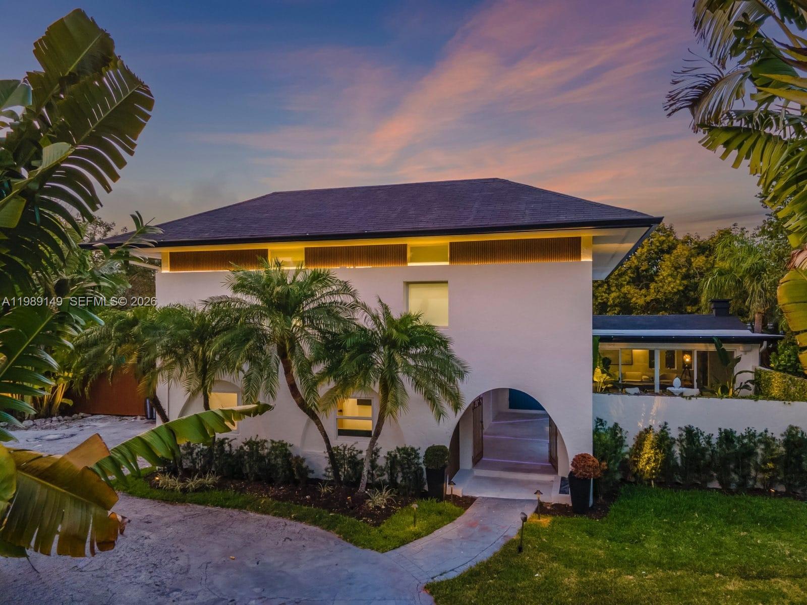 This magnificent estate spans 3,402 SQFT and sits on a lushly landscaped lot of 25,401 SQFT. Featuring 6 bedsand 4 baths, with 2 bedrooms and 2 bathrooms conveniently located downstairs. Designed with attention to detail,this home features a gourmet kitchen, a luxurious primary suite, a wine cellar, a saltwater pool, and an outdoorkitchen. Additionally, it's a smart home with cameras, impact-resistant windows, and a driveway thataccommodates up to 10 cars. The property also offers a resort-style backyard, Tesla car charging, Sonos soundsystem, camera security, pool chiller and heater, outdoor barrel sauna, Jacuzzi, and comes fully furnished.Situated in a non-flood zone. Near private schools, shops, restaurants, and marinas. This home is a perfect blendof luxury and functionality