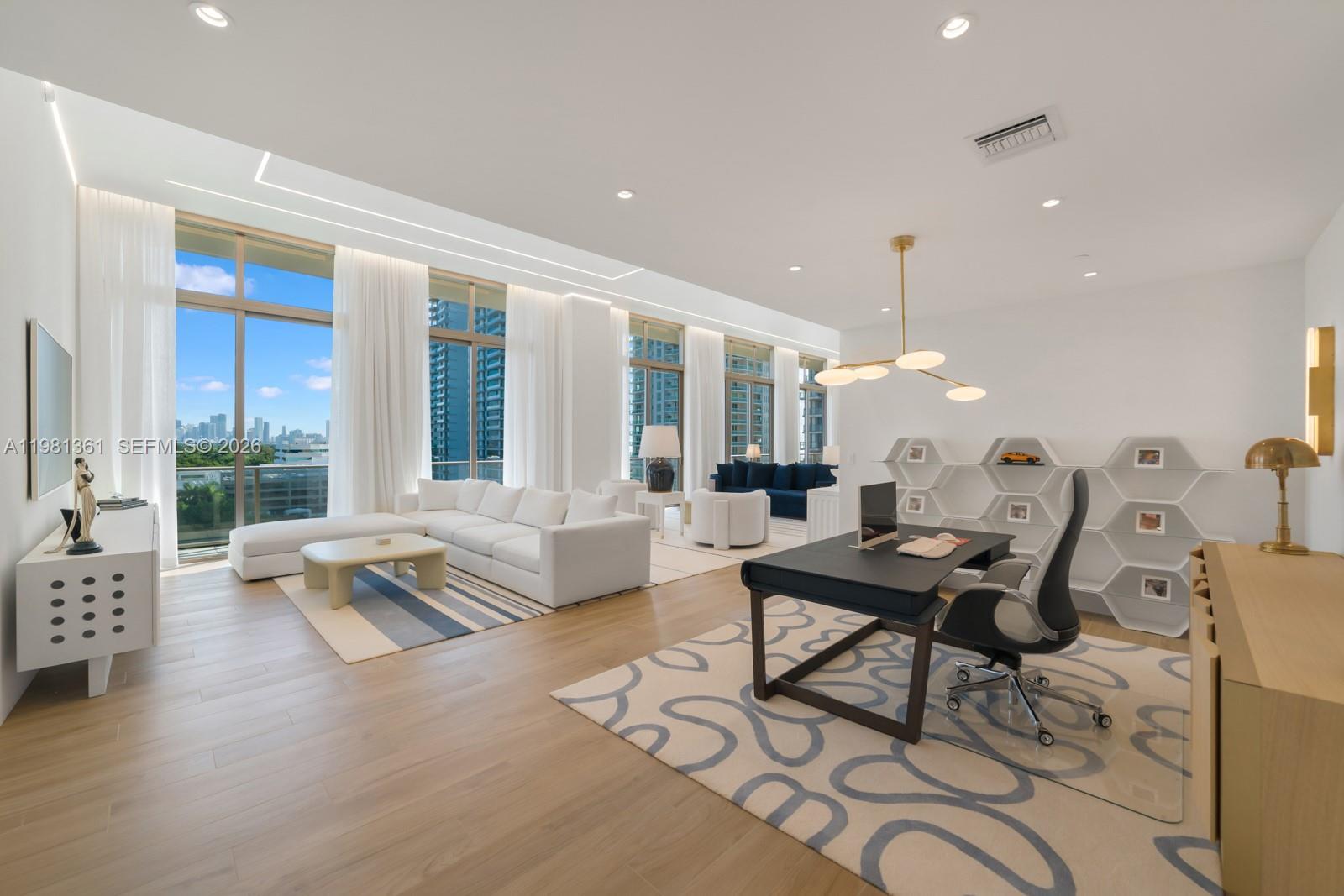 Residence 802 at Mr. C Tigertail is a truly 1-of-1 offering, custom designed by Terra Group for the current owner and unlike anything else in the building. Spanning 3,024 square feet of interior space complemented by 640 square feet of wrap-around terrace, this expansive 4-bedroom 4.5-bathroom home features 13-foot ceilings, creating volume and a sense of light you will not find in other residences. This home opens to an expansive living and dining area framed by floor-to-ceiling glass with seamless indoor-outdoor flow. The layout is completely unique, enhanced with custom ceilings & doors, wood flooring, thoughtful upgrades and a configuration that balances everyday living with easy entertaining. The kitchen features Italian cabinetry, terrazzo & quartz surfaces and Sub-Zero & Wolf appliances. The primary suite feels tucked away and serene, with a spa-like bath and generous closet space, while the additional bedrooms are well proportioned for family or guests. The wrap-around terrace expands the living areas and brings in the surrounding Grove atmosphere. Residents enjoy the full Mr. C lifestyle with concierge and butler service, a ground-floor restaurant, rooftop pool, bar and lounge, fitness center, yoga and Pilates studio, billiards room and spa. Set in the heart of Coconut Grove’s bayfront neighborhood, one of Miami’s most walkable areas, you’re surrounded by an eclectic mix of restaurants, shopping and entertainment along with access to some of the area’s best schools.