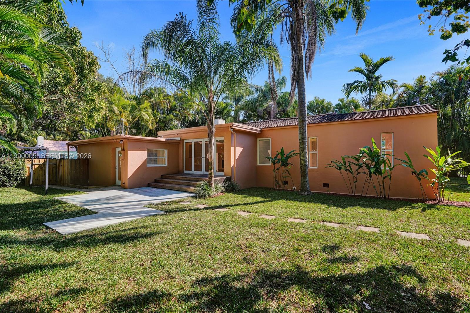 Open-concept living area at 20 101st St - Home in Miami Shores