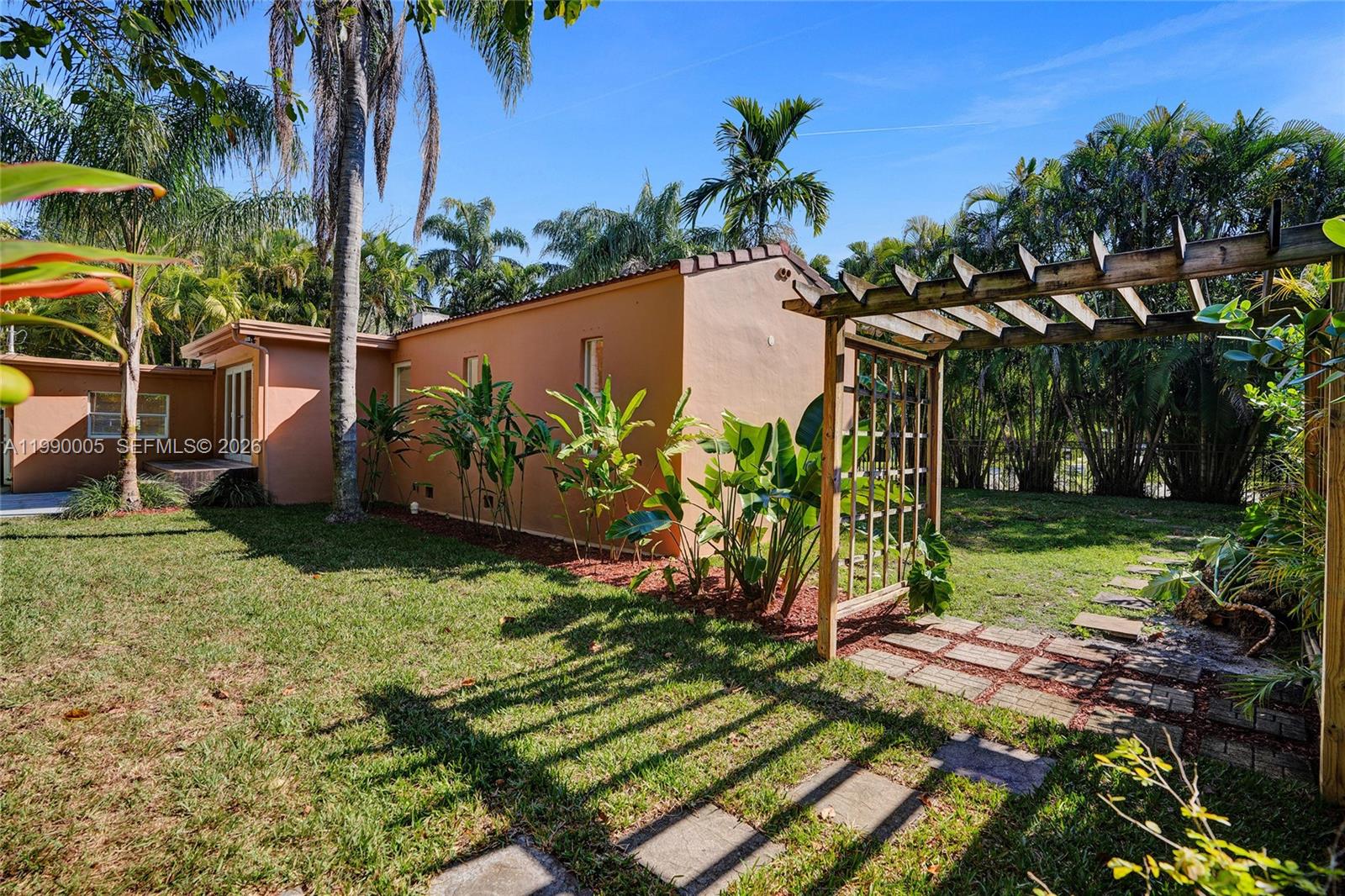 Elegant master bedroom retreat at 20 101st St - Home in Miami Shores