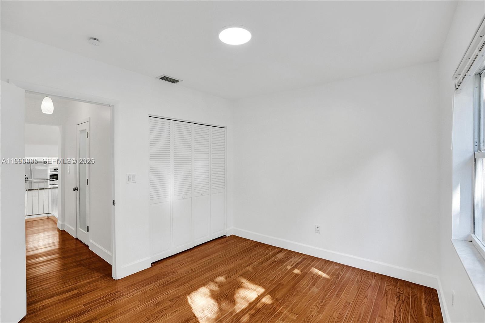 Well-appointed guest bedroom at 20 101st St - Home in Miami Shores
