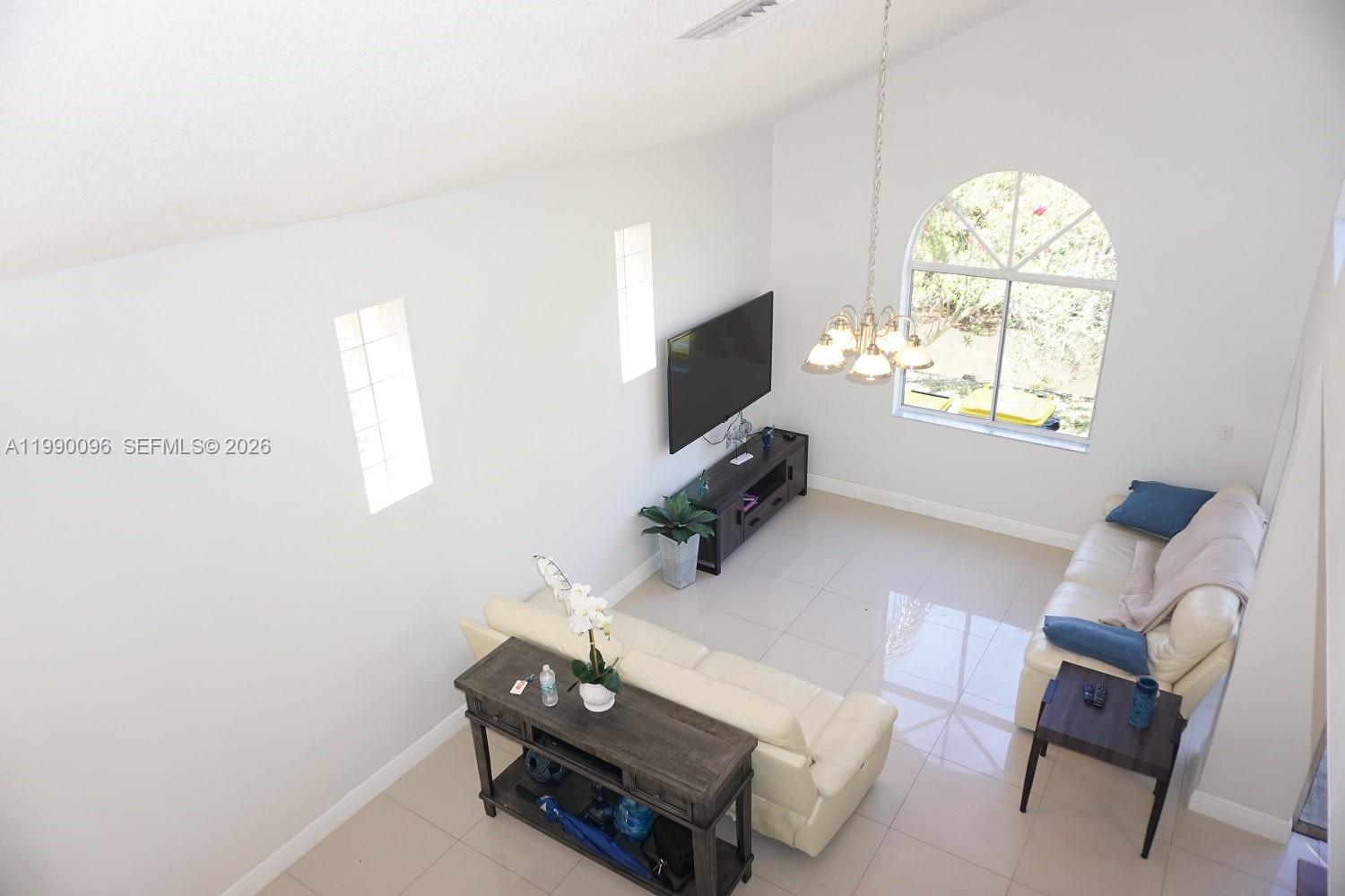 Open-concept living area at 1057 6th Ave - Home in Dania Beach