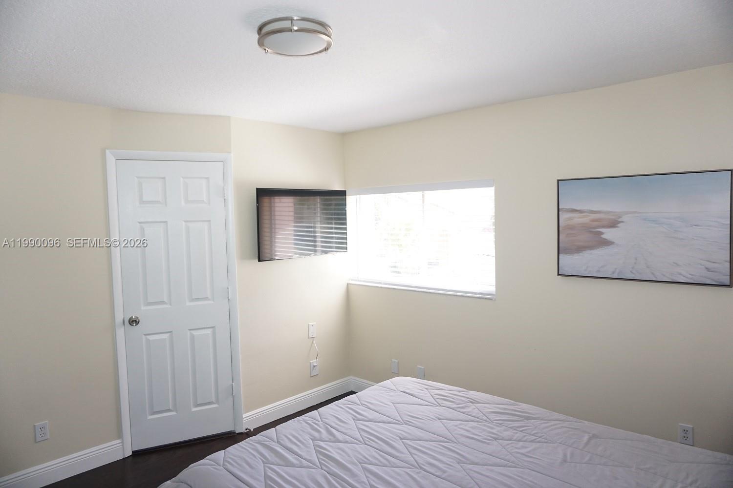 Elegant master bedroom retreat at 1057 6th Ave - Home in Dania Beach