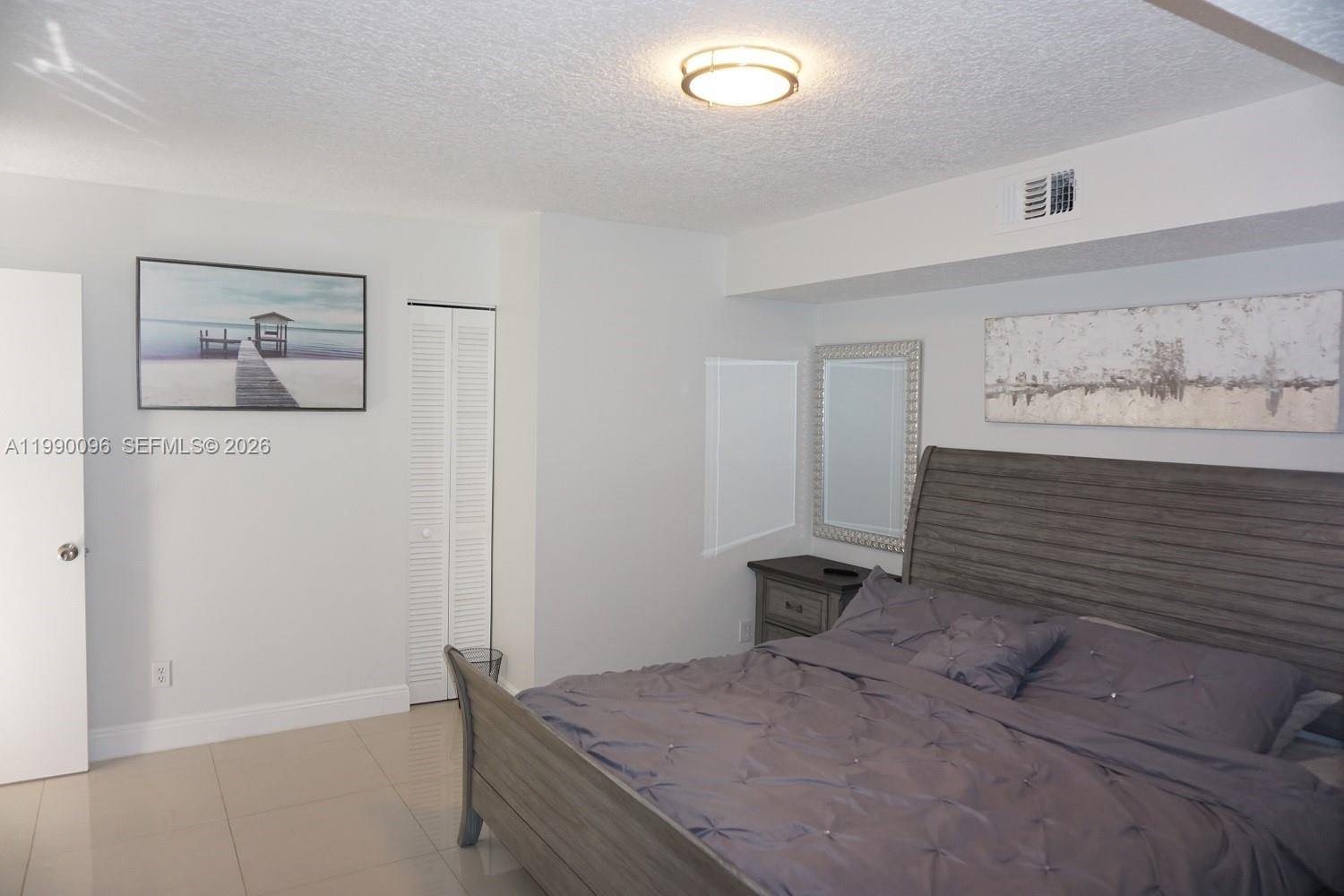 Elegant master bedroom retreat at 1057 6th Ave - Home in Dania Beach