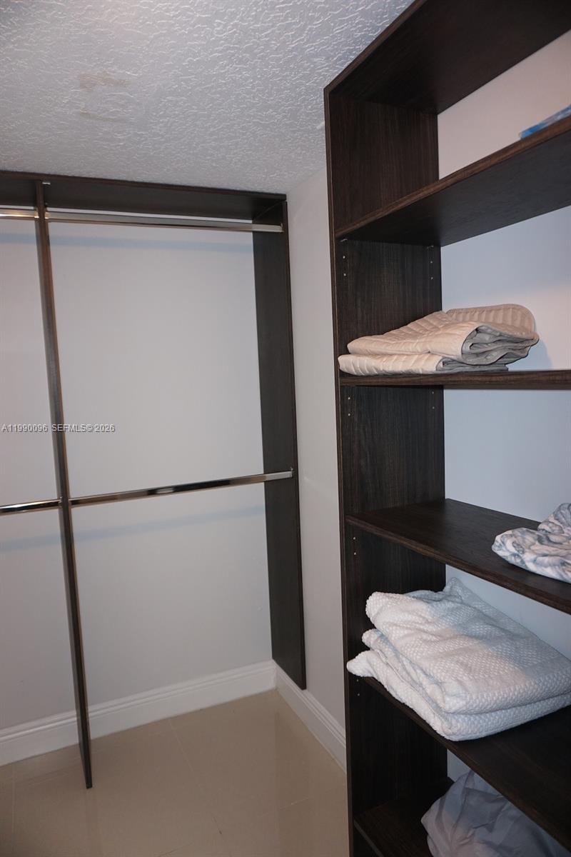Well-appointed guest bedroom at 1057 6th Ave - Home in Dania Beach