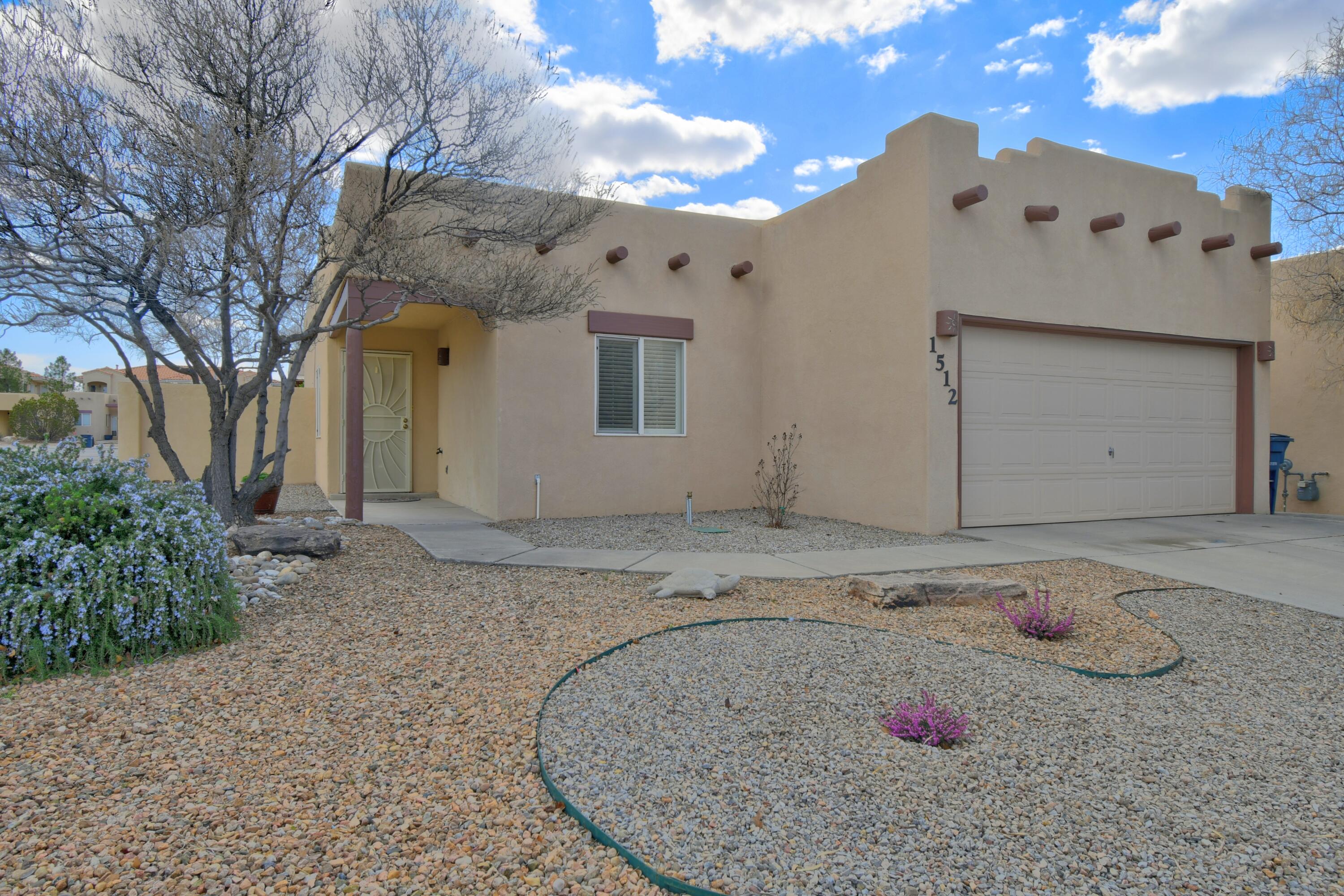 This single-level Southwestern home sits on a quiet corner with a spacious backyard featuring trees, patio, and flagstone. This almost 1,200 s.f. layout includes 2 bedrooms, 2 baths, and a 2-car garage. The primary suite offers a walk-in closet and backyard access. The kitchen, updated with new countertops and appliances, opens to living and dining areas with 10' ceilings. Recent upgrades include a refrigerated air conditioner, furnace, hot water heater, and bathroom countertops. Most floors are wood, with ceramic tile elsewhere; no carpet. Landscaping is low-maintenance. Appliances convey ''as-is''. Home is located in the Vista Del Norte neighborhood, which is centrally located in ABQ, has nice walking paths and a park nearby.