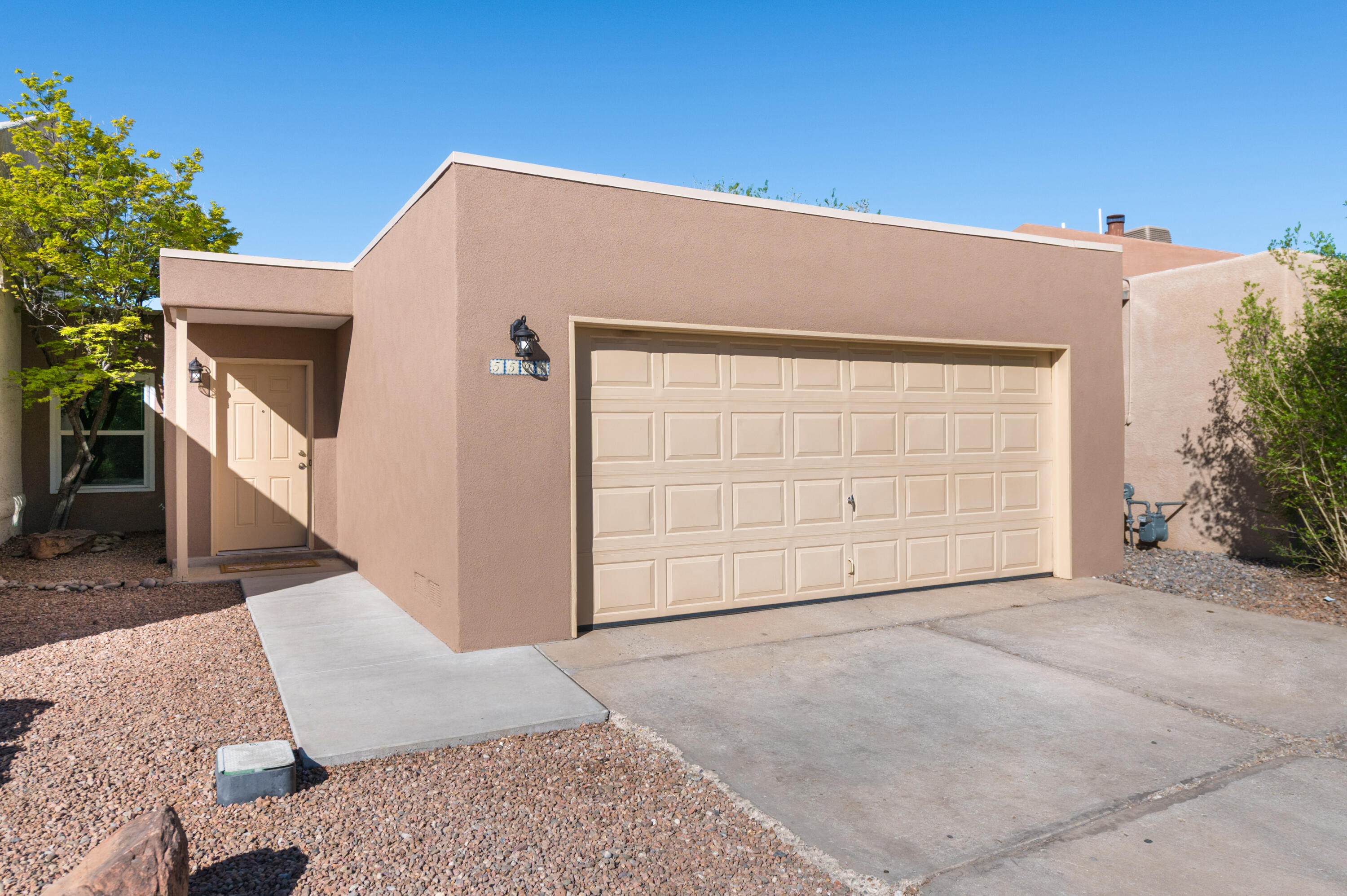 Move in Ready  One Story Townhome Located in Desirable NE Location.  This Charming Home offers Two Bedroom, Two Bath and Two Car Garage.  Spacious living room with large Kiva fireplace and high ceilings,  perfect for both everyday comfort and entertaining guests. The kitchen offer ample counter space and cabinets with a eat in dining space.   Recent updates include  New Carpet in the bedrooms and living room and New Vinyl   in the kitchen. New gas stove. And New Stucco. Easy Care Landscaping in the backyard.  A Great Place to Call Home