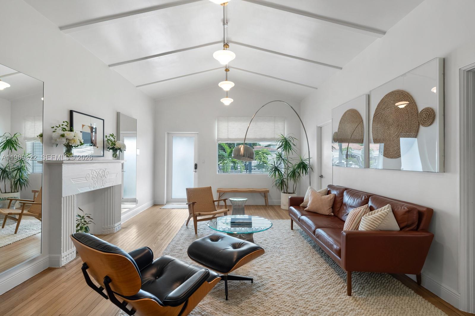 This stunning 4-bedroom, 3-bathroom home is in the middle of South Beach. Featuring a spacious, private front yard with a sleek black fence, and a rooftop deck with city views. Inside, enjoy an airy living room with vaulted ceilings, a decorative fireplace, and wood floors. The primary suite includes high ceilings and a cozy sitting area. With tastefully designed bathrooms, a second-floor loft, and a serene outdoor patio, this home offers the perfect blend of comfort and luxury. Located in a prime neighborhood, close to shopping, dining, and major roads. Schedule a tour today! Additional 500 Liv SF for the loft bedroom per owner.