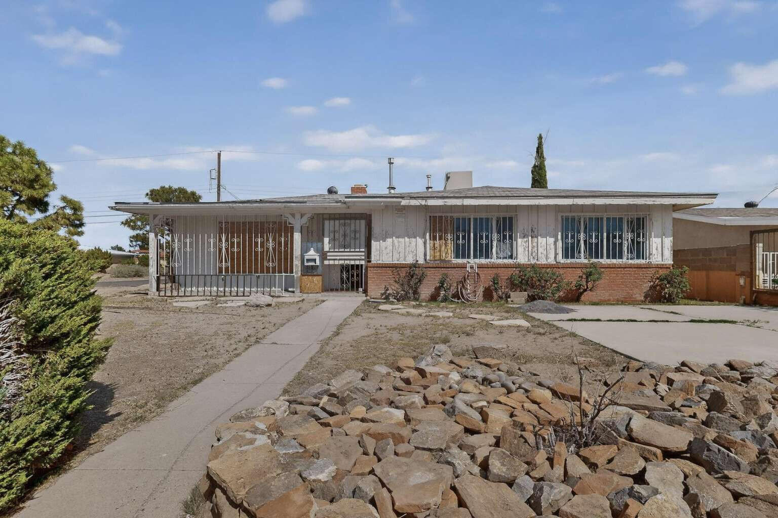 Transform this solid-foundation 3-bedroom, 2-bathroom home into your dream property while building instant equity. At 1,799 square feet on a generous 7,122 square foot lot, this West Mesa gem offers incredible potential for the savvy buyer who understands renovation financing. This home needs complete renovation - no utilities currently connected, roof replacement required, and full interior updates needed. The foundation appears solid, providing a strong base for your renovation project. Perfect for owner-occupants looking to customize every detail while building significant equity from day one.  Location Benefits: Situated near Pat Hurley Park with West Mesa High School nearby. Spacious front and back yards provide excellent outdoor living potential on this oversized lot