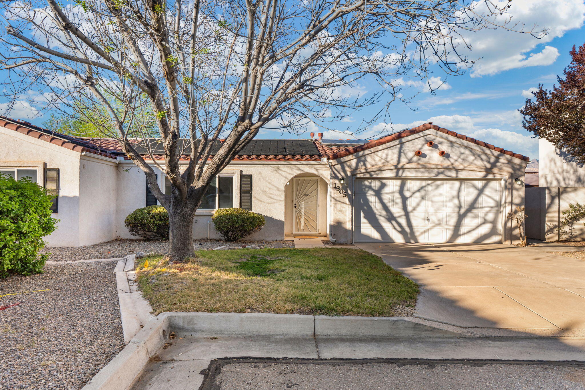 This turnkey gem in Vista Del Norte is the one you've been waiting for. Step inside to a light-filled living room with elevated ceilings and an inviting, open feel. Luxury vinyl flooring runs throughout--no carpet anywhere. The white kitchen is full of charm with granite countertops and timeless finishes. Out back is the true showstopper: a beautifully designed pool and in-ground hot tub, creating your own private retreat. All appliances convey, making move-in effortless.