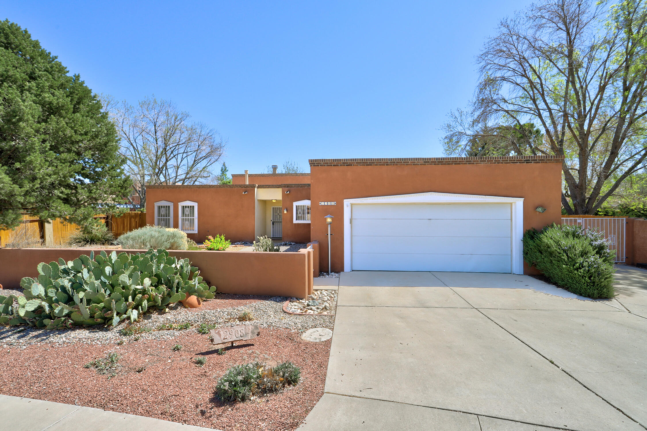 Welcome to this beautifully maintained Leslie-built home on a spacious 1/4-acre lot in one of Albuquerque's most sought-after neighborhoods in the heart of the North Valley. Opportunities like this don't come around often. This single-story home offers 3 bedrooms, 2 bathrooms, and an open-concept layout filled with natural light from four skylights. Raised beamed ceilings and a cozy gas fireplace create a warm, inviting living space. The kitchen offers great functionality for everyday living and entertaining. The primary suite features an updated closet, and both bathrooms include renovated walk-in showers. Recent upgrades--newer furnace, water heater, and evaporative cooler. A heated bonus room (18' x 10') provides flexible space for an office or gym.