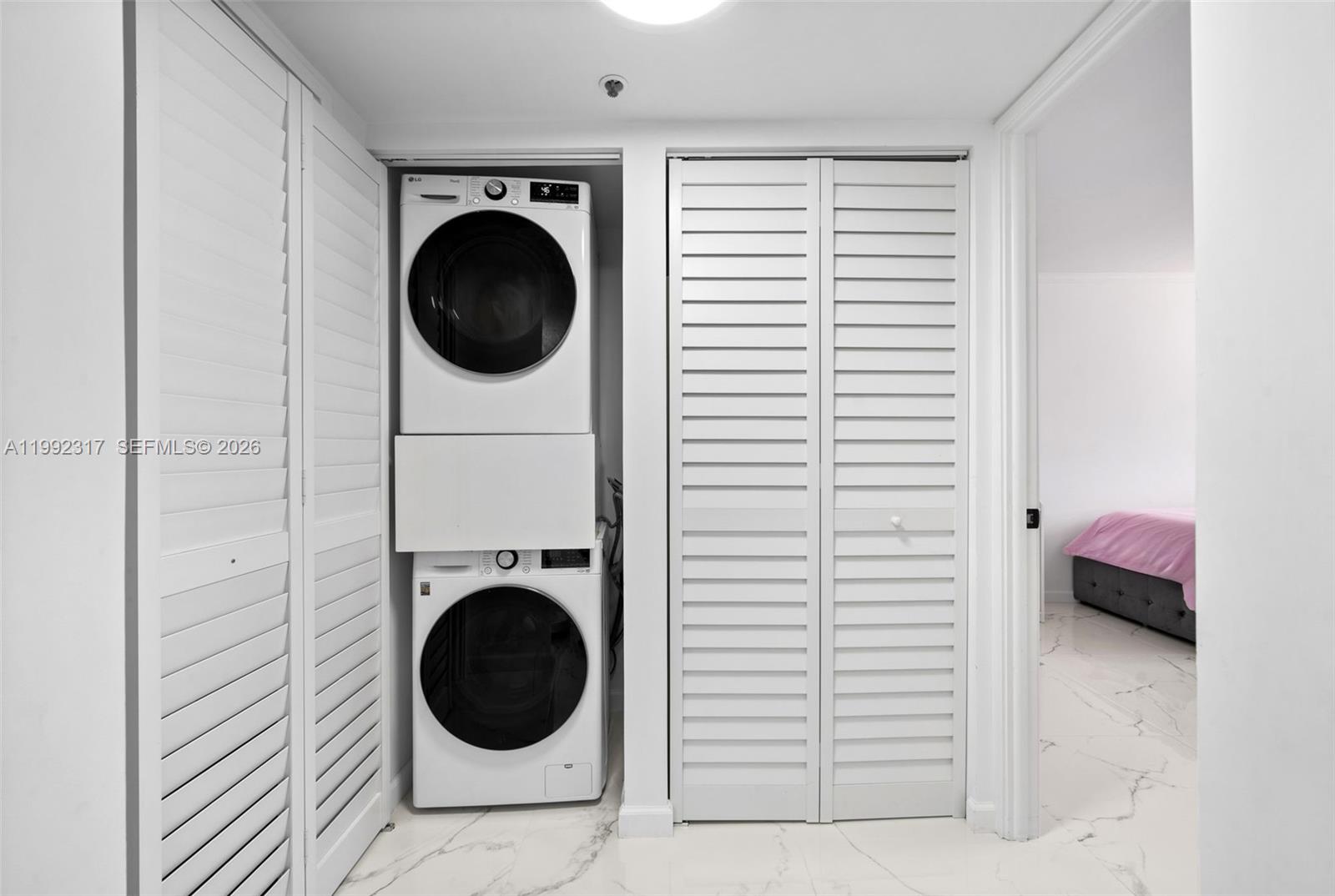 Well-appointed guest bedroom at 210 174th St - Condo in Sunny Isles Beach