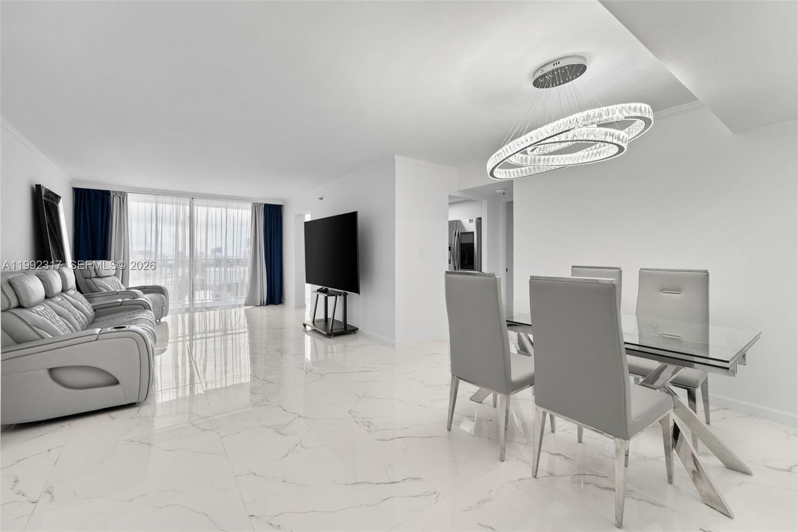 Spacious living room with panoramic views at 210 174th St - Condo in Sunny Isles Beach