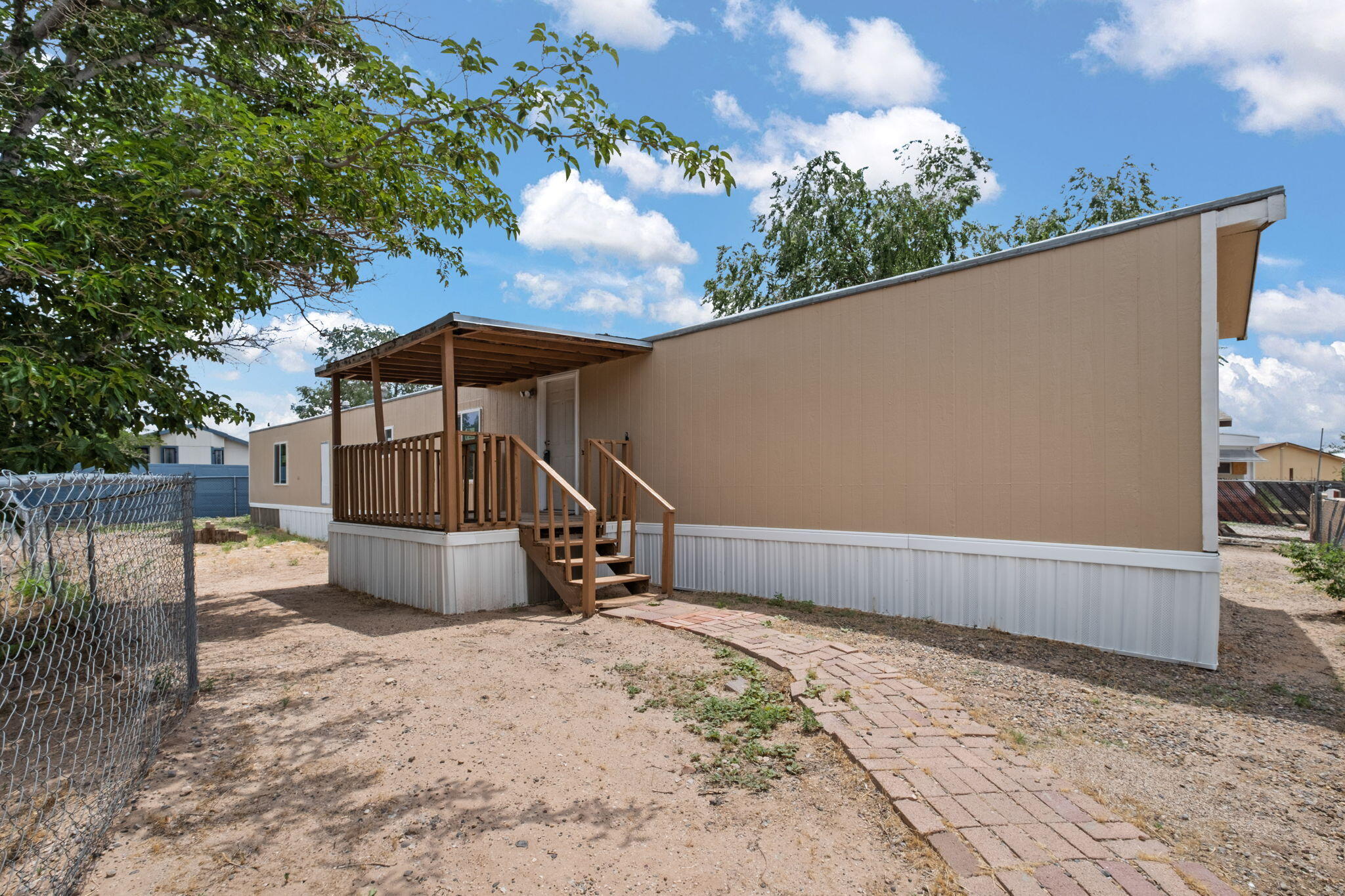 Welcome to this updated manufactured home for sale featuring a remodeled kitchen, modern countertops, remodeled master bathroom and new stylish flooring throughout. This move in ready home offers fresh interior and exterior paint, updated energy-efficient windows, and a bright, open living space perfect for comfortable everyday living. Situated on a spacious lot with yard access, this property provides extra parking, or room for storage and outdoor living.  Enjoy a combination of modern upgrades, functional layout, and great curb appeal.  Don't delay, schedule your showing today!