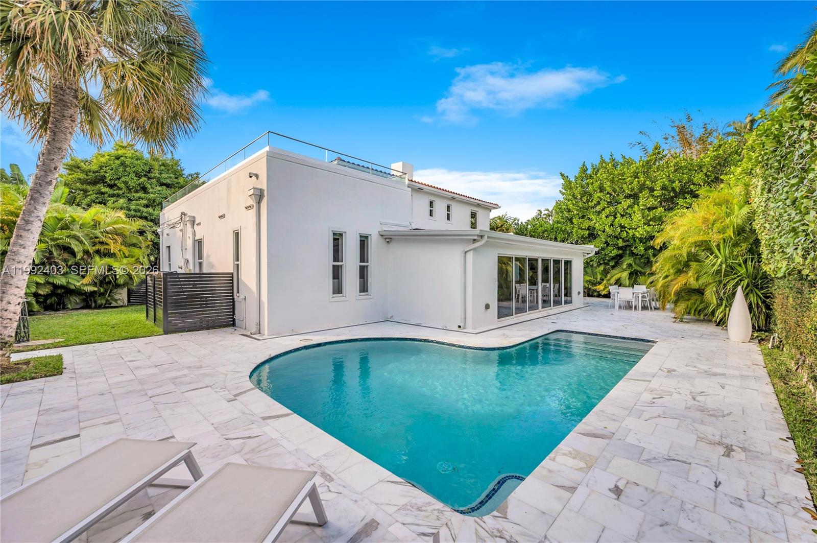 Move right in—just bring your furniture and personal belongings. This fully completed residence is truly turnkey and ready to be enjoyed from day one.Located in a peaceful, family-friendly Miami neighborhood with a strong sense of community, the home offers convenient access to parks, top-rated schools, and everyday essentials—while remaining just minutes from the water, beaches, and Miami’s finest dining and entertainment.Originally built with solid concrete construction, the property has been completely rebuilt to near new-construction standards, retaining only the original concrete walls. Every detail has been thoughtfully reimagined, featuring a redesigned floor plan and a full reconstruction with high-end materials and modern systems throughout.Exceptional finishes include Carrara marble flooring seamlessly extending from interior to exterior, custom Italian concealed doors, premium countertops, a striking designer staircase, and top-of-the-line appliances.Major upgrades include a brand-new roof, resurfaced pool, and a newly built terrace deck—perfectly blending indoor and outdoor living.Additional highlights feature electric screens and blinds, full crawl-space encapsulation, and a flood-prevention pump system—offering both comfort and peace of mind.A truly one-of-a-kind residence that must be experienced in person to be fully appreciated.
