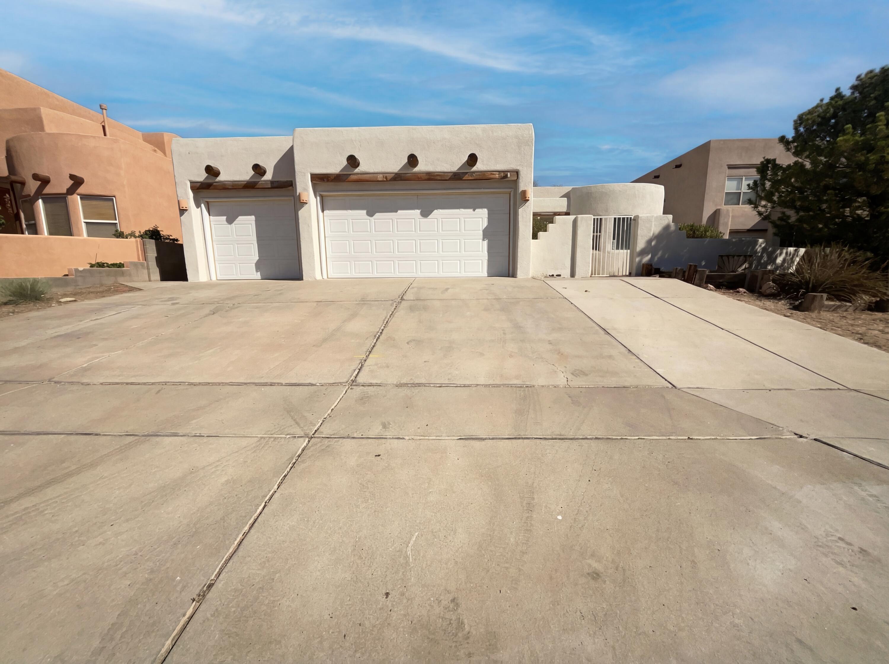 Welcome to 6331 Pima Pl NW, a home that exudes charm and comfort. The living room is cozy with a fireplace, leading to a kitchen that boasts an accent backsplash and a functional kitchen island. The primary bedroom is a retreat with a walk-in closet, and the primary bathroom is a sanctuary with double sinks and a jacuzzi tub. Outside, enjoy a covered patio overlooking a fenced-in backyard with a storage shed. The property is surrounded by low maintenance landscaping. The home has been refreshed with fresh interior and exterior paint, a new roof, and partial flooring replacement. This property is a true gem, ready for you to make it your own. Included 100-Day Home Warranty with buyer activation