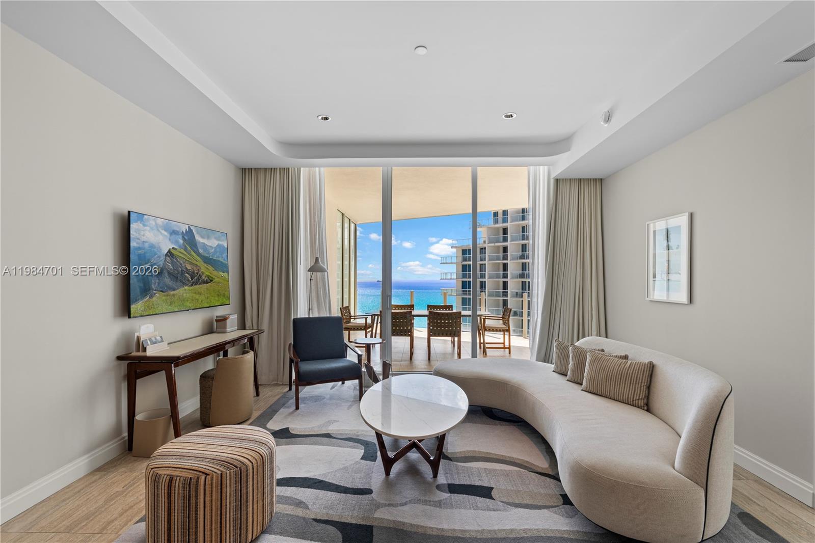 Rising above the Atlantic shoreline at the Four Seasons Private Residences, this exceptional 1 bedroom, 2 bathroom oceanfront retreat offers 1,458 SF of refined interiors and 1,958 total SF including an expansive private terrace, delivering a seamless blend of elevated design and resort style living in one of Fort Lauderdale’s most coveted addresses.Floor to ceiling glass frames sweeping ocean views, filling the residence with natural light and creating a serene coastal backdrop from every principal space. The open concept living and dining areas extend effortlessly to the oversized terrace, perfect for sunrise mornings and evening entertaining. A sophisticated interior palette is complemented by marble and tile flooring, custom built ins, and a thoughtfully designed layout that balances comfort with modern elegance.The primary suite offers a tranquil escape, while the additional full bath enhances functionality for guests. A fully equipped kitchen and in residence washer and dryer complete the home’s effortless livability.Residents enjoy the full service lifestyle synonymous with Four Seasons, including valet parking, a secured lobby, doorman service, resort style pool, spa, fitness center, and curated amenities, all set along a premier stretch of beachfront with direct ocean access.A rare opportunity to own a turnkey oceanfront residence where luxury, privacy, and world class service converge.