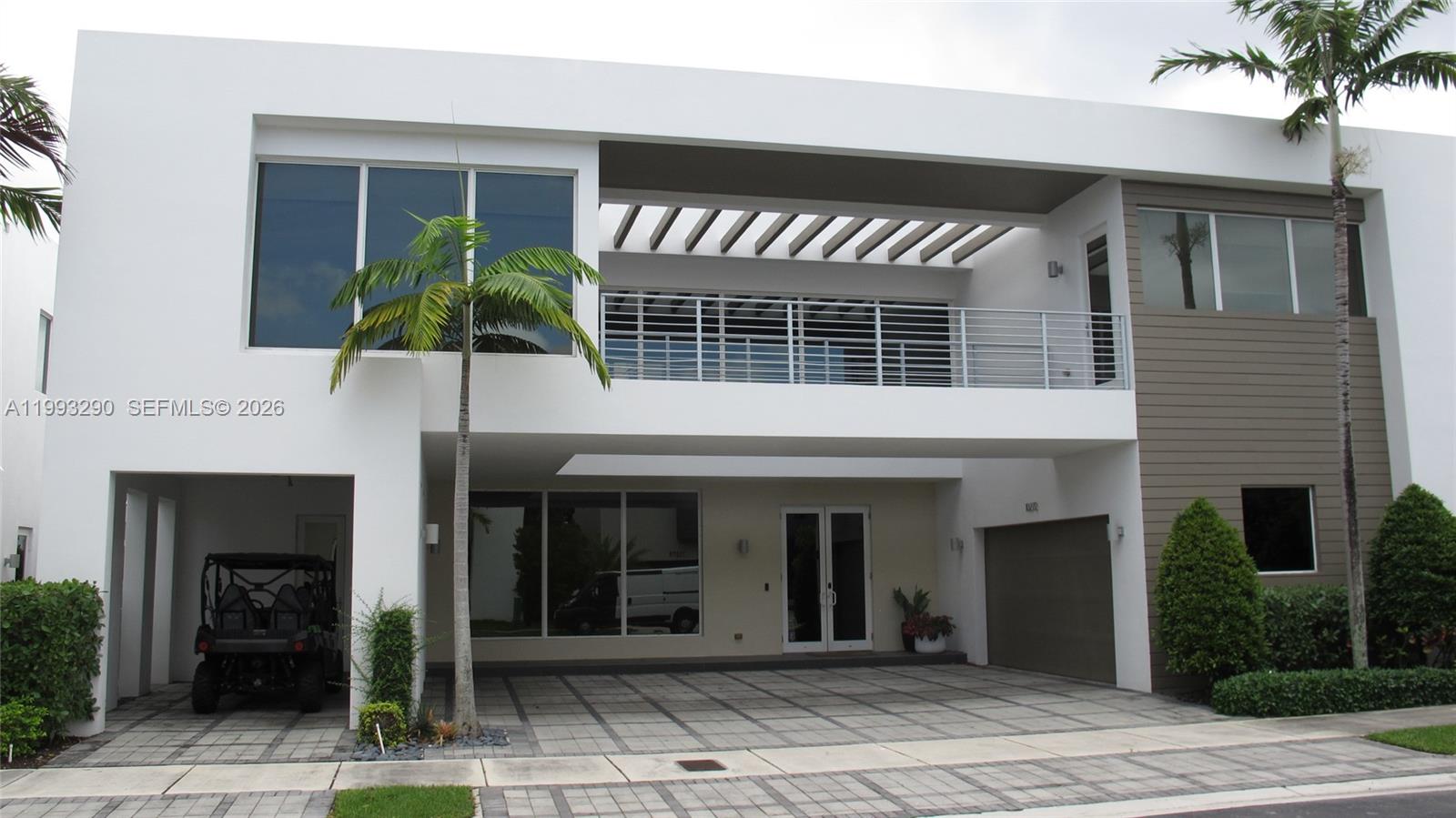 This is the best opportunity in Modern 75, featuring a direct, unobstructed lake view and representing the largest and most complete model in the community. Stunning and impeccable smart home offering 6 bedrooms and 7 full bathrooms, marble and wood floors, and soaring high ceilings throughout. Impact windows, gourmet kitchen with top-of-the-line stainless steel appliances, and modern glass and steel staircase railing. 2-car garage plus driveway space for up to 6 additional vehicles. Spectacular lakefront backyard with built-in BBQ, sink, and refrigerator—ideal for entertaining. Solar panels provide an autonomous energy source and significant savings on electricity. Located in a full-service, gated community with 24/7 security and resort-style amenities including clubhouse, fitness center, pool, spa, gym, business center, media room, and children’s play areas. MUST SEE!