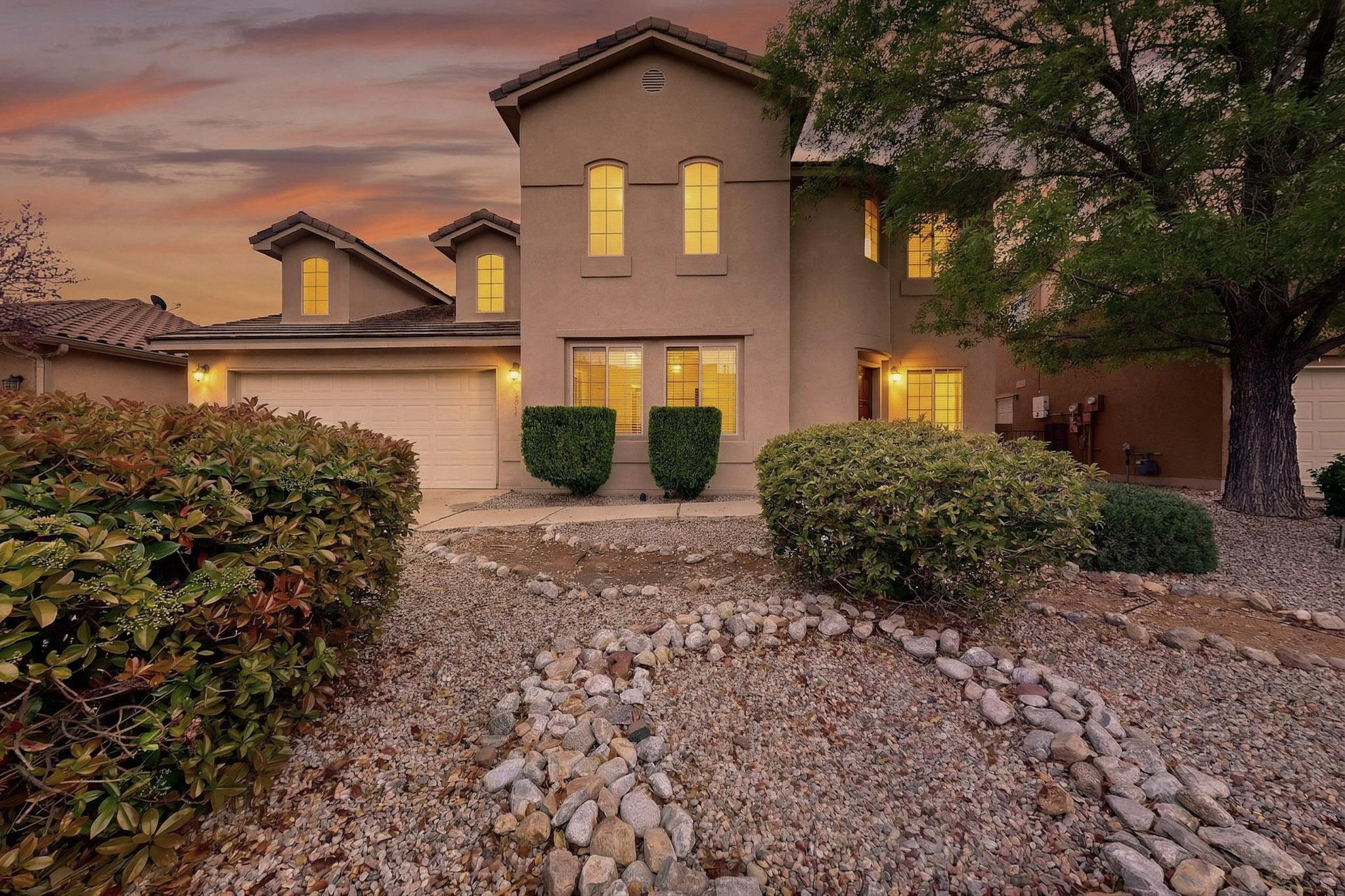 Nestled in a desirable gated community near the Bosque, this home provides an ideal setting with quick access for a smooth commute. Surrounded by mature cottonwoods and scenic trails, it backs up to open space, offering a rare opportunity for those eager to connect with nature without compromising on convenience. This spacious custom-built home boasts a well-designed layout featuring a generous primary suite that includes a cozy sitting area or office space and a private balcony showcasing unobstructed views of the Bosque. Notable features include a tile roof, thermal break low-E windows, and synthetic stucco, dual AC units. The oversized three-car tandem garage offers ample storage and flexible workspace options. With high-performing solar panels, utility costs are covered, leaving you