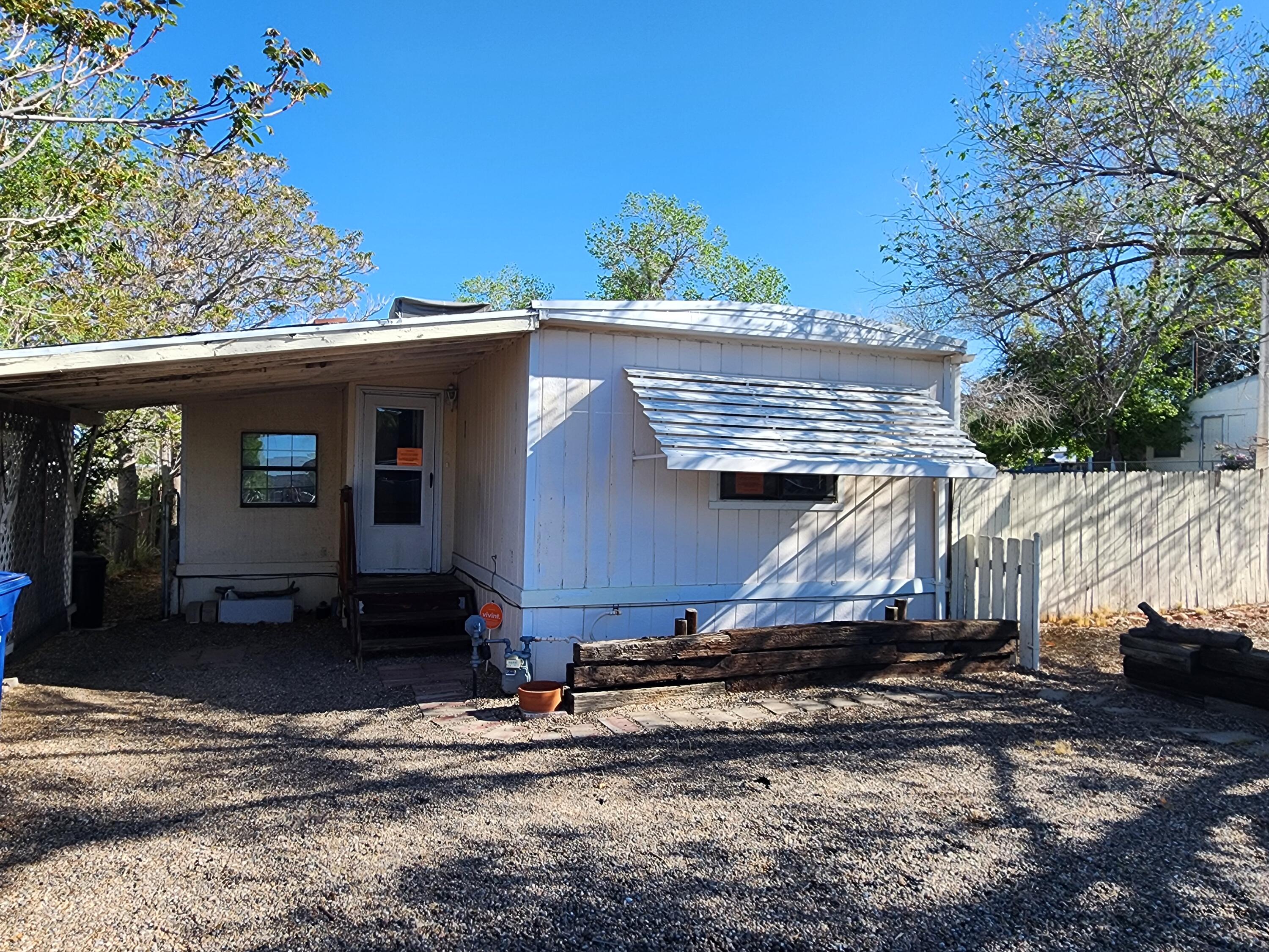 Expanded Single Wide on owned lot. 4 bedrooms, 2 bathrooms, spacious living room, kitchen, and added dining room, plus a bonus sunroom (not heated and not added to square footage). Carport and fenced back and side yards. Owner Financing Considered