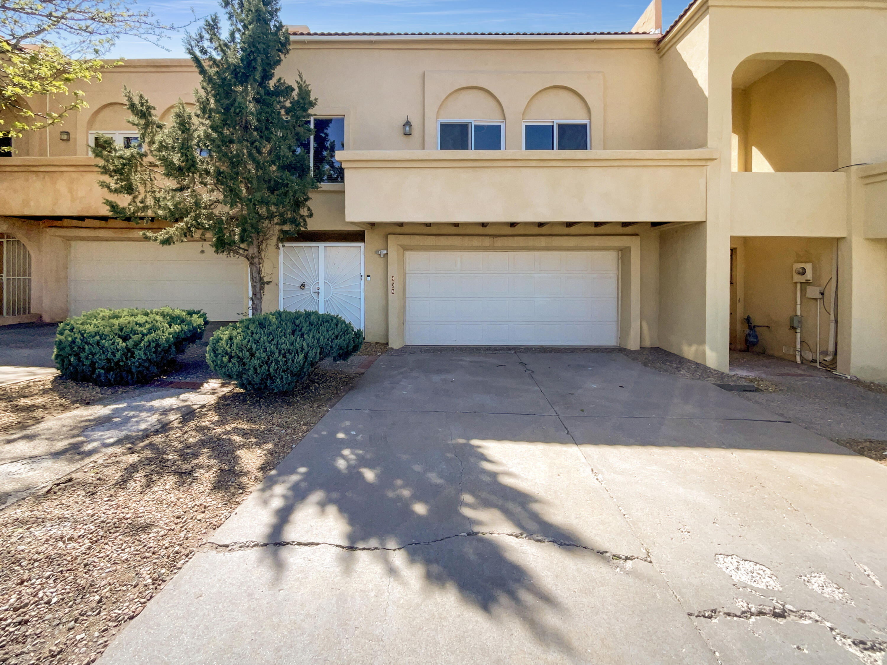 Discover the distinctive charm of 438 Pinon Creek Rd SE, where the kitchen stands out with a stylish accent backsplash that adds a touch of character and visual appeal. The main living area is centered around a cozy fireplace, creating a warm and inviting atmosphere. The primary bathroom is thoughtfully designed with dual sinks for added convenience, while partial flooring updates enhance the overall look and feel in select areas. Set within an established neighborhood, this residence presents a well-maintained and enduring presence with a cohesive and comfortable design. Included 100-Day Home Warranty with buyer activation