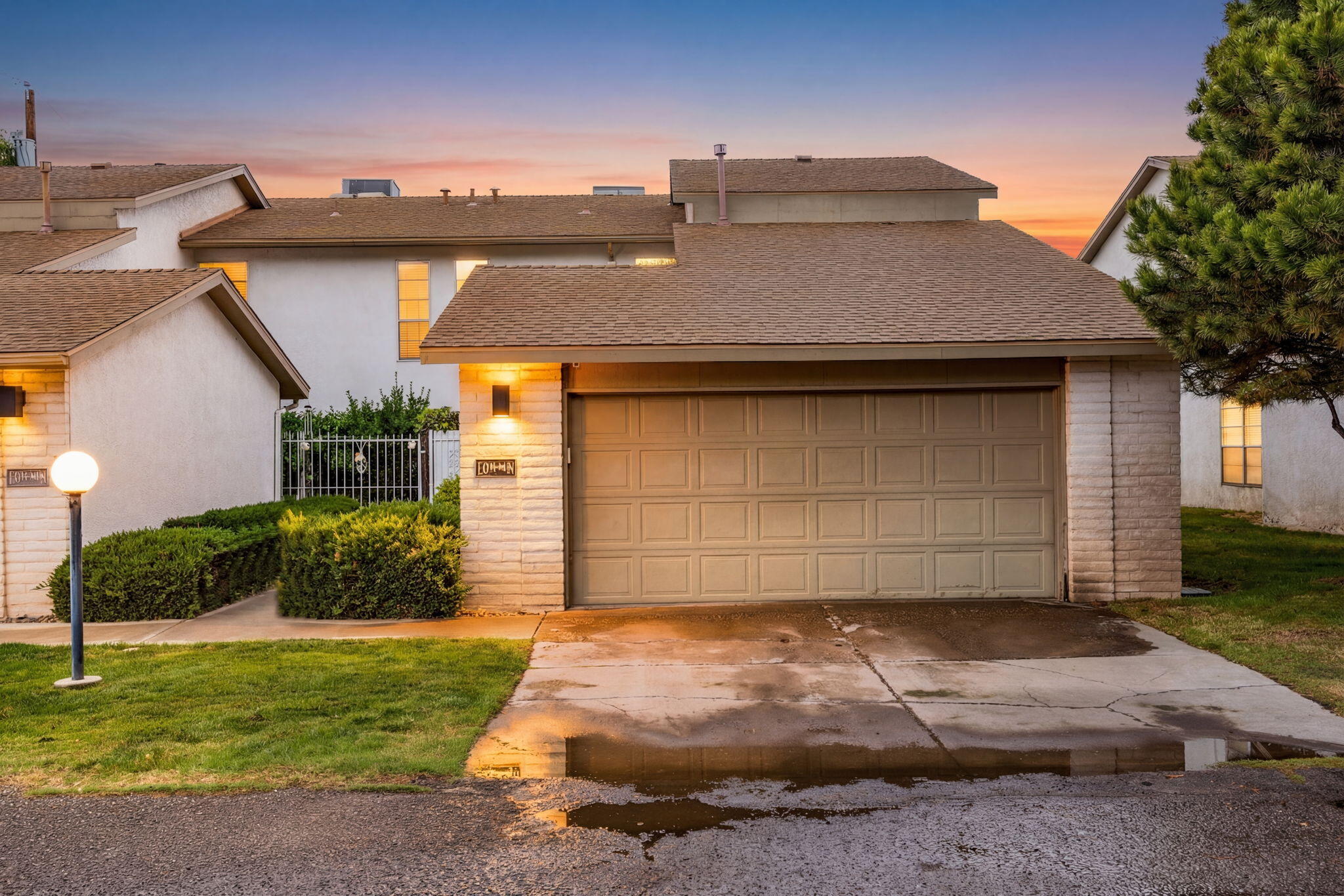 Step into easy living in this beautifully maintained townhome located in the popular Del Farrell community. This inviting two-story offers 3 bedrooms, two comfortable living areas, a 2-car garage, and a beautifully landscaped backyard. Enjoy a cozy living area off the kitchen with a warm gas fireplace, enhanced by wood-look tile flooring that flows throughout the main living areas. The galley kitchen offers generous cabinet and counter space, stainless steel appliances, and a breakfast bar perfect for casual dining. Brand new carpet flows throughout the upstairs, where you'll find a relaxing owner's suite with his and hers closets and a private bath. Serene landscaped backyard. Community pool! HOA covers Trash, water, front landscaping and the common area!