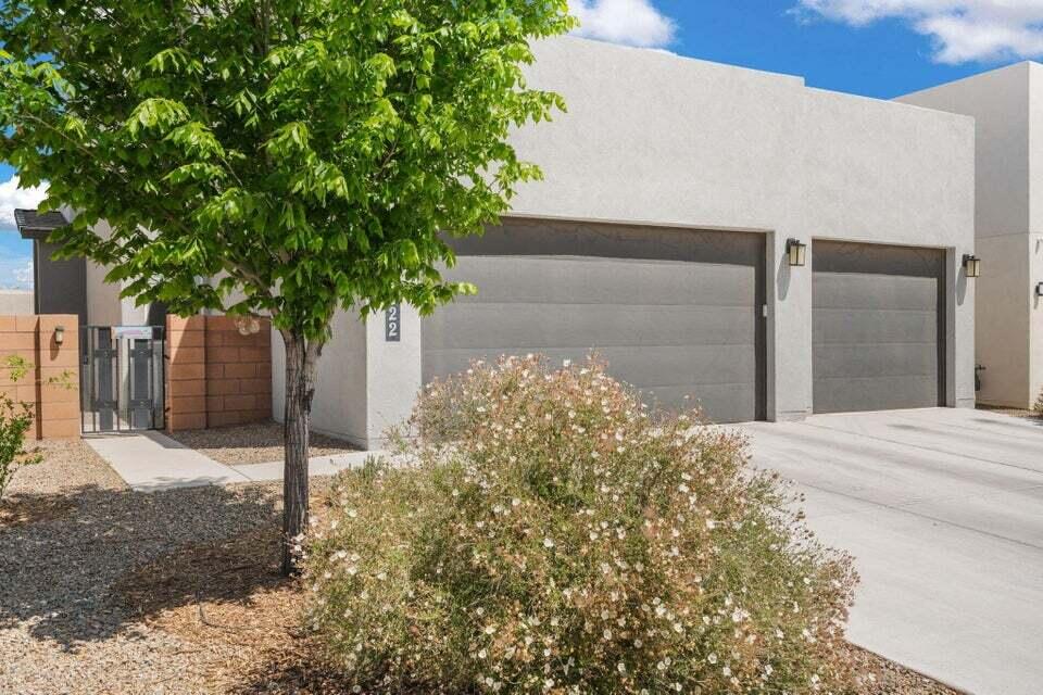 OWNED SOLAR PANELS, 3 CAR GARAGE, AND FULLY LANDSCAPED BACKYARD! Welcome to this beautifully designed Westway Homes Venetian floor plan in southern Rio Rancho. Open concept living, kitchen, and dining area perfect for entertaining. The kitchen offers high-end appliances, designer cabinetry, quartz countertops, a large walk-in pantry, and a butler's pantry. Upstairs, the spacious primary suite includes a private balcony with Sandia Mountain and city light views and a luxurious bathroom with soaking tub and walk-in shower. The oversized 3 car garage provides plenty of space for vehicles and storage, and the fully landscaped backyard is complete and ready to enjoy. Owned solar and a great location near parks, restaurants, Rust Medical Center, and Market Street make this home move-in ready!