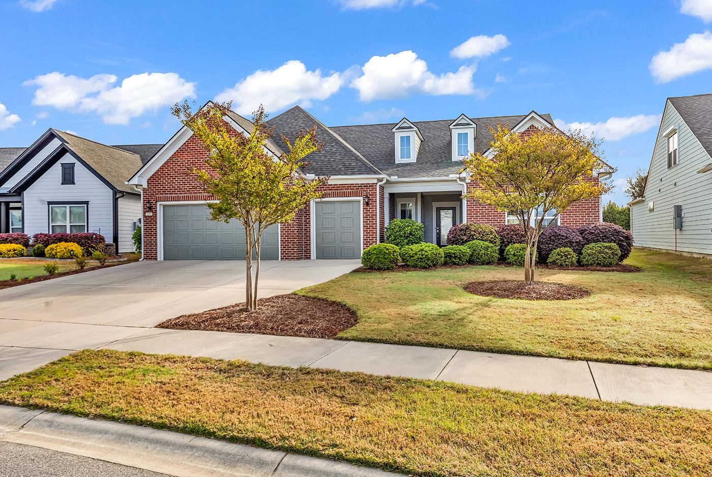 Located in Del Webb at Grande Dunes, a premier 55+ community in Myrtle Beach, this beautifully maintained Dunwoody floor plan offers the perfect blend of comfort, style, and low-maintenance luxury living. Thoughtfully designed with 3 bedrooms, 2.5 baths, plus an office and a spacious open-concept layout, this highly desirable plan is known for its functionality, comfort, and effortless everyday living.  Set on a large, private lot, this home offers exceptional curb appeal with a solid brick front and inviting exterior presence. Inside, the layout is both spacious and practical, with generous living areas designed for both entertaining and relaxed day-to-day living.  One of the standout features of this home is the added sunroom along with the enclosed Easy Breeze porch, creating the perfect space to enjoy the outdoors in comfort throughout the seasons. Additional highlights include a generator for added peace of mind and a well-designed layout that makes this home especially appealing for those seeking both convenience and quality within one of the area’s most sought-after active adult communities. Residents of Del Webb at Grande Dunes enjoy access to exceptional resort-style amenities, including a beautifully appointed Amenity Center, indoor and outdoor pools, fitness center, pickleball, tennis, bocce ball, and a full calendar of social events and activities. Scenic walking and biking paths, including a paved trail along the Intracoastal Waterway, add to the appeal, while convenient access to nearby shopping, dining, and the beach makes everyday living even better.  This is an exceptional opportunity to enjoy luxury, comfort, and lifestyle in one of Myrtle Beach’s most desirable 55+ communities.  This property is in South Carolina’s premier coastal community in Myrtle Beach, Grande Dunes. Stretching from the Ocean to the Carolina Bays Preserve, this 2600-acre development is amenity-rich and filled with lifestyle opportunities unrivaled in the market. Owners at Grande Dunes enjoy a 25,000 square foot Ocean Club that boasts exquisite dining, oceanfront pools with food & beverage service, along with meeting rooms and fun activities daily. Additionally, the community has two 18-hole golf courses along with several on-site restaurants, a deep water marina, a Har-tru tennis facility, and miles of biking/walking trails! Please visit our sales gallery located in Grande Dunes Marketplace to learn more about this amazing community you can call home.