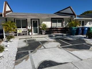 Beautiful updated home offers you everything that you need. All tiled floors. Stainless steel appliances ,Master bedroom with master bathroom. Nice size and updated rooms. High impact windows, and Doors. New Roof. Two parking spaces. Fenced backyard with patio. Excellent location. Low HOA $16.00 per month