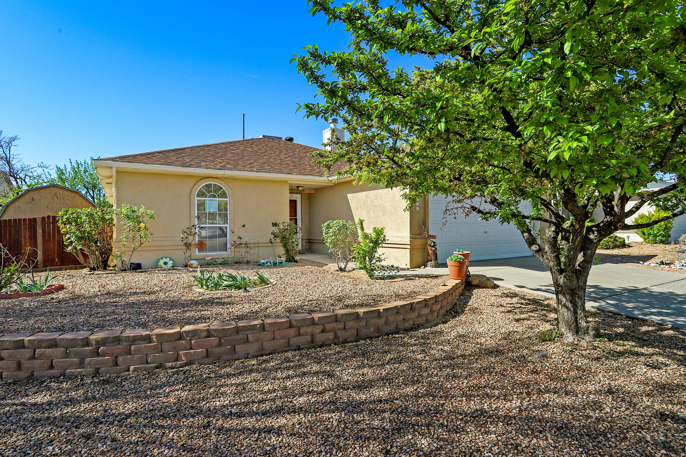 Adorable, structurally sound home that has been undeniably well taken care of. This home has three bedrooms, two baths, a cozy living room with vaulted ceilings and a fire place, along with a comfortable eat in kitchen. Recent updates include a new roof in 2024. Redone stucco in 2019. Updated evap. cooler, water heater, and carpet. Newer stainless steel kitchen appliances. Laminate floors in the living room and tile in the wet areas. Covered patio with easy maintenance backyard. Convenient location, close to I40, Coors, shopping, dining, and more. Move-in ready, waiting for a new owner! See it, love it, and make it happen!