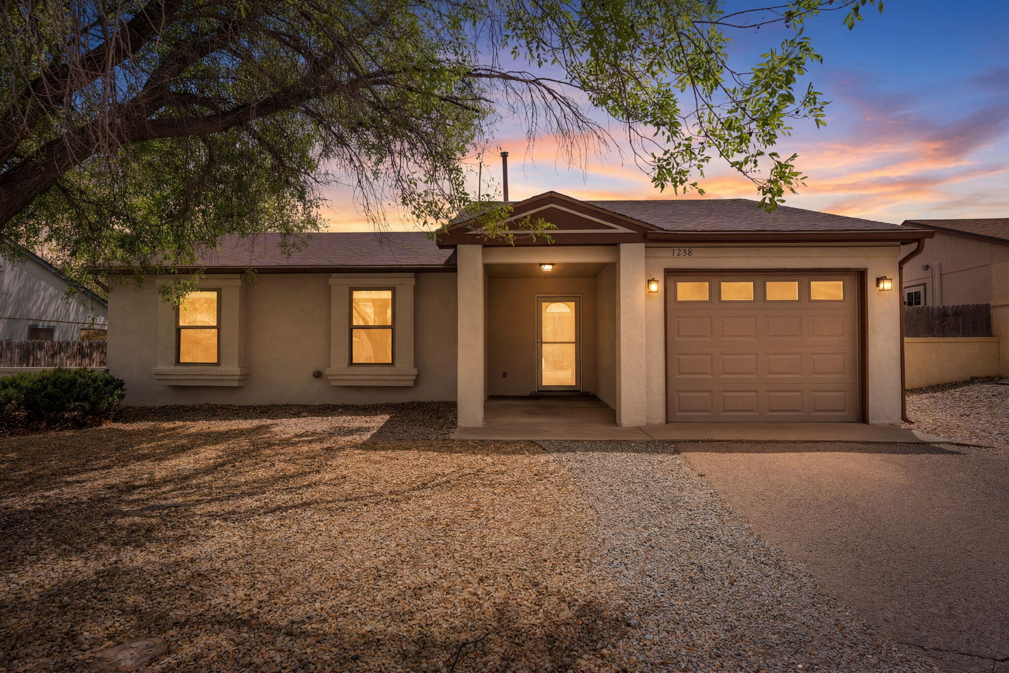 This near-total remodel shows like a new build. The reimagined kitchen features new cabinets, countertops, a breakfast bar, stainless appliances, and a modern tile backsplash. Enjoy vaulted ceilings, fresh paint, and new baseboard trim throughout. Upgrades include all-new Anderson windows, new blinds, and new exterior doors, including French doors off the kitchen. Both bathrooms are renovated, highlighted by a floor-to-ceiling tile shower in the master. Major systems are updated with a new garage door/motor, a whole-house water softener, a new furnace and replacement of poly pipes. The exterior boasts fresh paint, full landscaping with a new weed barrier, and an extended concrete patio. Super clean and move-in ready. Call the listing agent for a full list of upgrades!