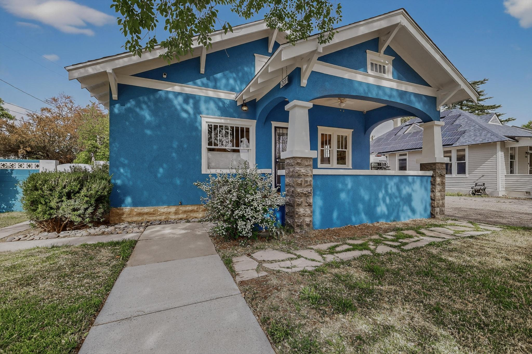 Timeless character in the heart of Albuquerque. This charming 3bed, 2bath home offers 1,542 square feet of living space, blending classic appeal with thoughtful updates in one of the city's most desirable historic areas.From the moment you arrive, you'll notice the fresh stucco and new interior and exterior paint, along with classic Craftsman style tapered columns set on solid masonry piers, creating a striking first impression and timeless curb appeal. Inside, original hardwood floors and classic glass pane details add warmth and character you simply won't find in newer construction.The home features refrigerated air for year round comfort, functional layout, and a 1 car garage. Step outside to a private backyard retreat, complete with new fencing, and cozy patio space. Schedule n
