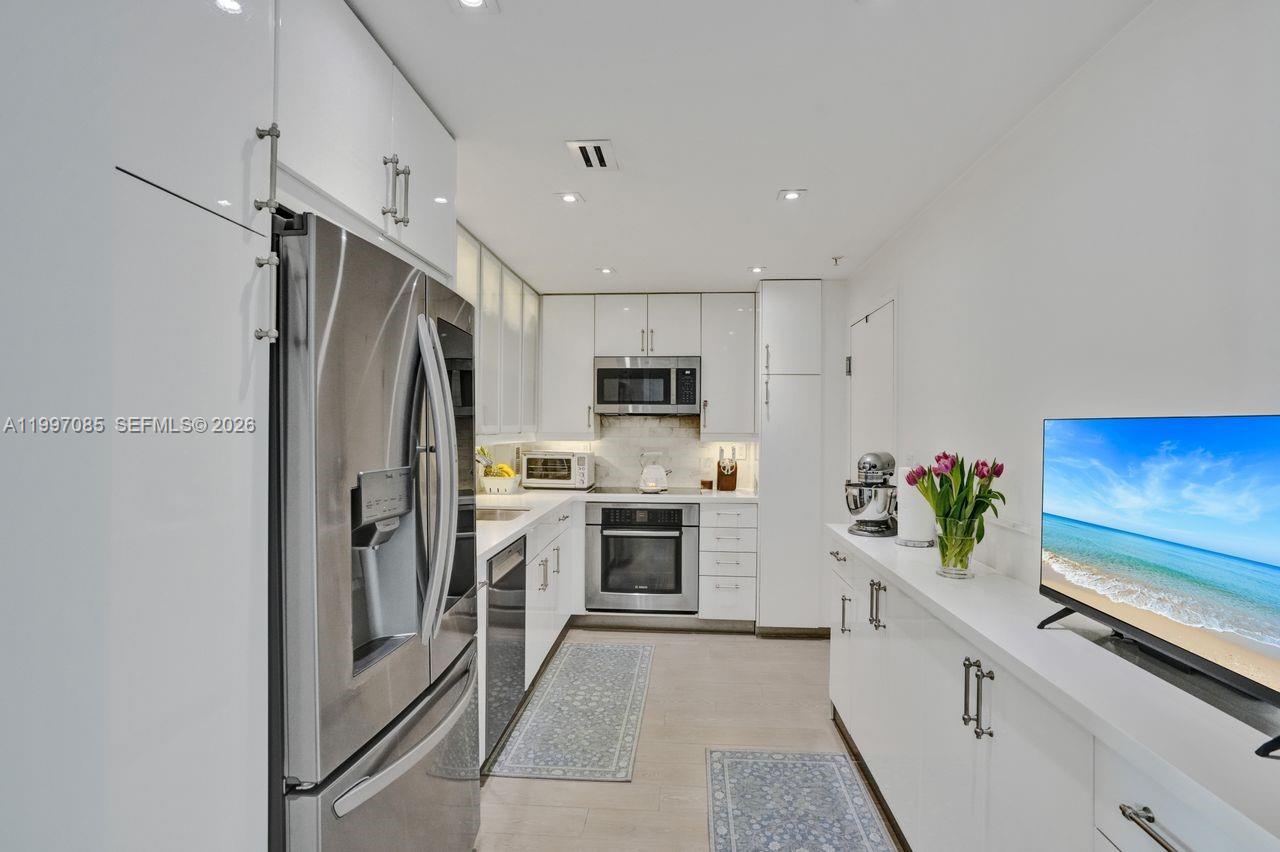 Rarely available 2/2 split floor plan facing south ,with amazing views of the Bay ,waterway & Coco Plum  mansions and Marina.Unit 625 was totally renovated with high end finishes including California Closets and other great built-ins, including a  large wine cooler. The kitchen offers high end SS appliances with Quartz countertops, and custom kitchen cabinets. Large great room with Dining room, living room combination, leading to floor to ceiling Impact Glass Sliding doors  to the terrace and water views.Both bedrooms offer impact windows and  bathrooms are updated with walk in shower and bath-shower combination in 2nd bathroom. Gables Waterway Towers was recently remodeled and has 24/7 Concierge ,Valet & security. Amenities include a front and rear lobby, Heated Pool, Media-Party Room, Fitness and game rooms. There are also boat slips that come up for lease or sale. The building has good reserves and has passed all of the required safety recertifications, " It's like living at a resort, all year long".