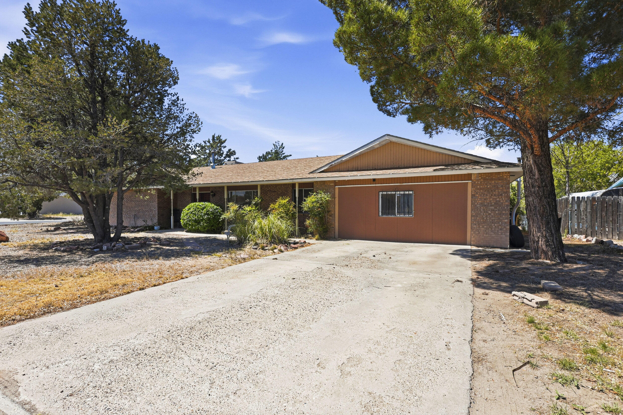 This well-situated corner lot property offers the flexibility and space today's buyers are looking for, with the added bonus of backyard access and no HOA restrictions. Mature, seasoned trees create a welcoming setting with shade and privacy, while the spacious layout inside provides room to live and grow. Featuring two separate living areas, the home offers versatility for entertaining, relaxing, or creating a dedicated workspace. The large converted garage adds even more functional space and could serve as a second family room, game room, or potential fourth bedroom depending on your needs. With three bedrooms and two bathrooms, plus the option for a fourth bedroom, this home is full of opportunity. The seller is offering a $7,500 credit to the buyer,