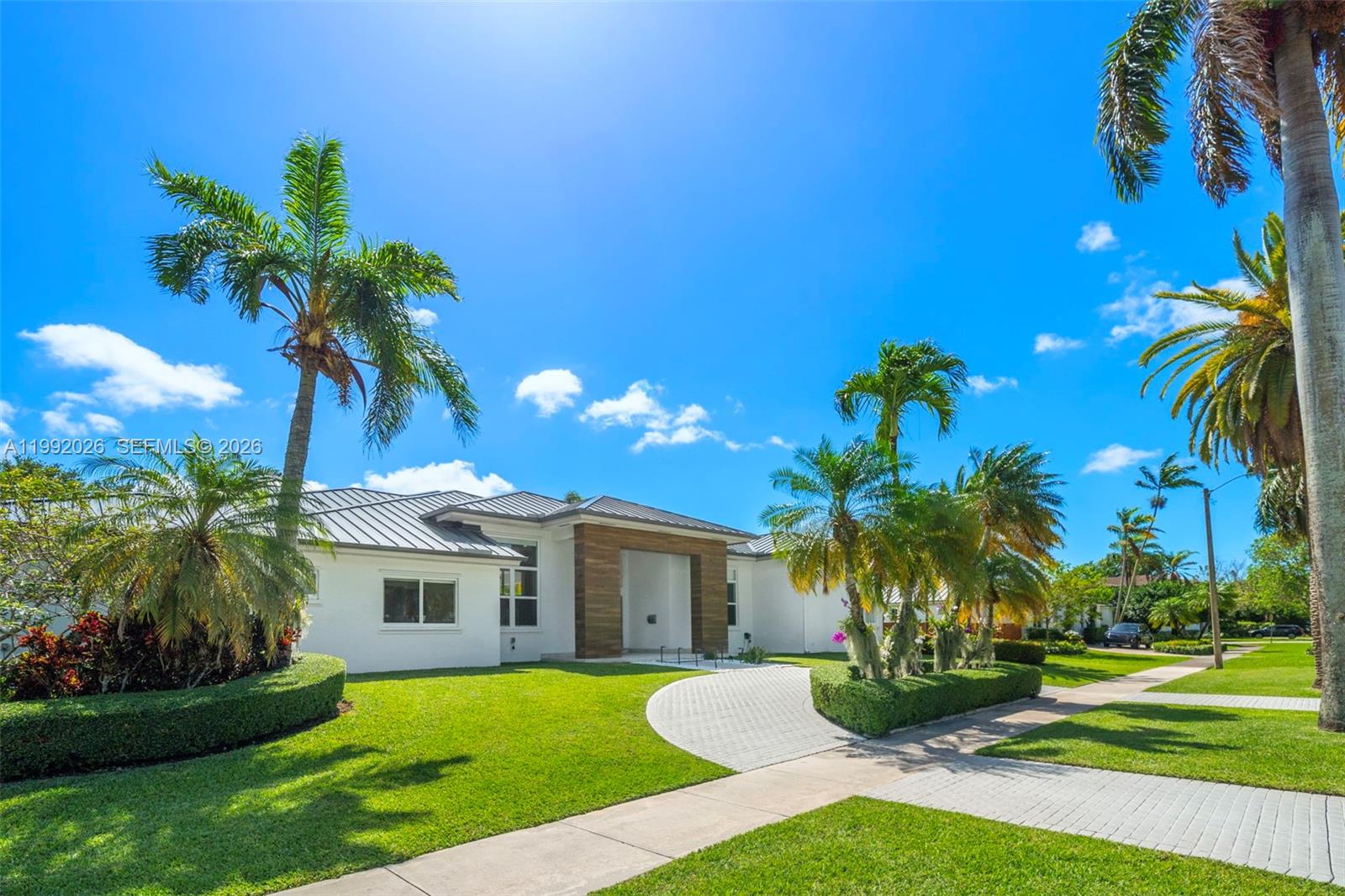 Beautifully updated Palmetto Bay Pool Home in excellent location! 4 Bedrooms 3 full bathrooms. Large master suite with dual walk in closets and a large custom bathroom. Formal living and dining rooms. Large kitchen with breakfast nook that opens to generous family room. Light and bright! Impact glass throughout. Interior laundry room. Metal roof. Electric car charger. One of the two car garages has been professionally converted into a nice office. Split floor plan with dual ACs. Very close to Coral Reef Park, Coral Reef Elementary and Houses of Worship.