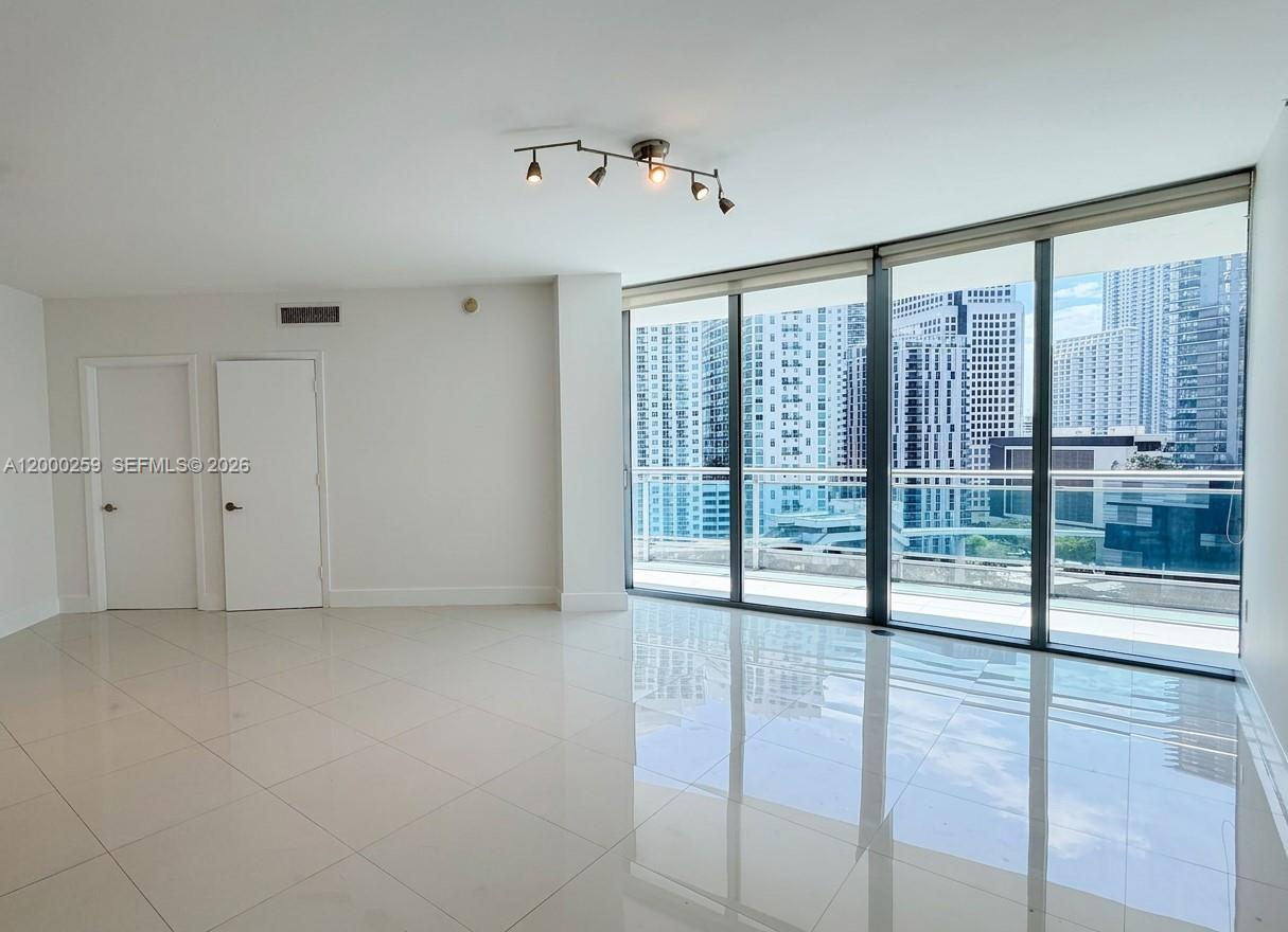 Experience elevated riverfront living at Wind Condominium in the heart of Brickell. This spacious 3-bedroom, 2-bath residence offers 1,385 SF of interior space, the largest floor plan in the building, featuring an open layout filled with natural light and floor-to-ceiling windows showcasing stunning ocean and vibrant city views.The unit boasts a modern kitchen with Italian cabinetry, granite countertops, and stainless steel appliances, along with elegantly finished Porcelanosa bathrooms. Generously sized bedrooms and a large private terrace provide abundant natural light throughout the day and the perfect setting for indoor-outdoor living.Wind is a gated riverfront community offering resort-style amenities including a 30,000+ SF pool deck overlooking the Miami River, state-of-the-art fitness center, spa with sauna and steam rooms, racquetball court, clubhouse, business center, and 24-hour concierge and valet services.Ideally located between Brickell and Downtown, just steps from Brickell City Centre, dining, shopping, and the Metromover, this residence offers the perfect blend of urban convenience and waterfront tranquility.