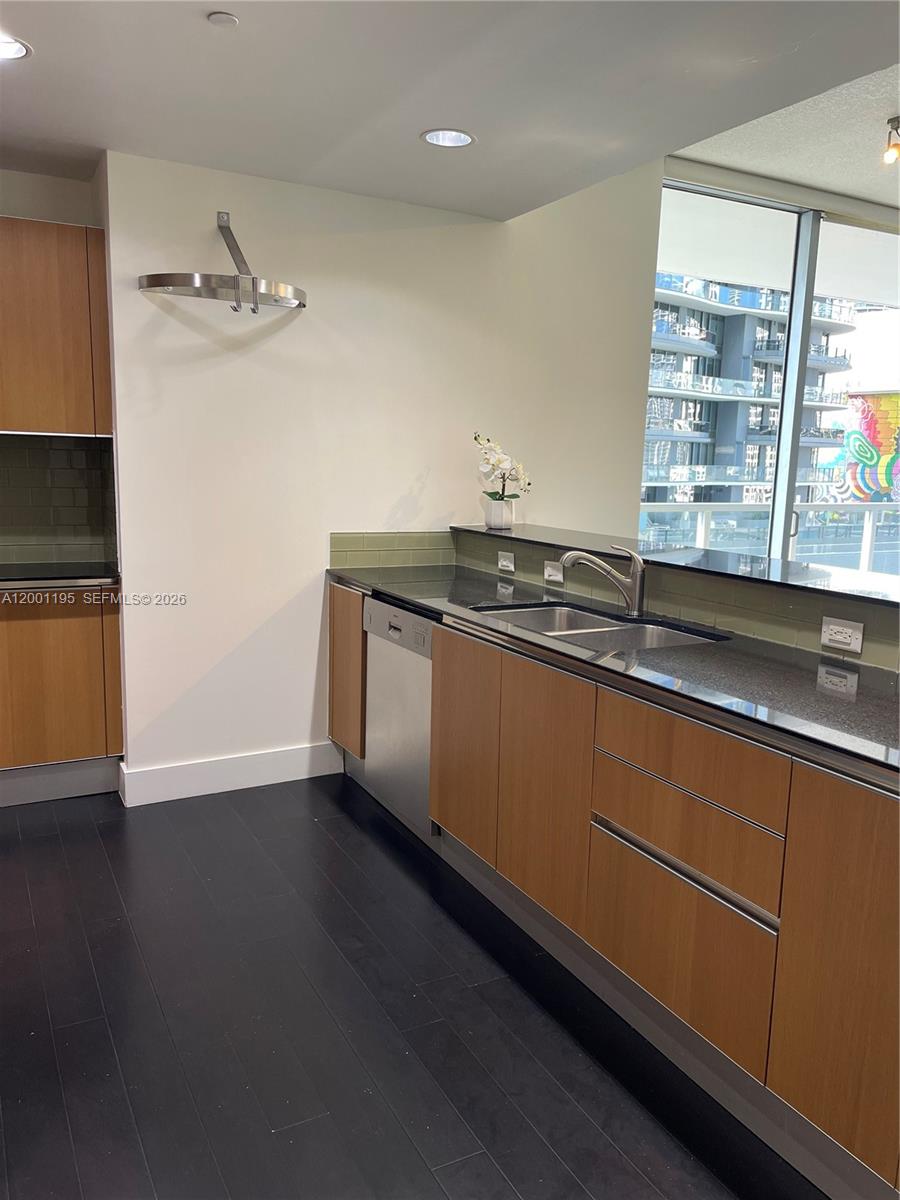 Stunning 2-bed/2-bath condo in the heart of Brickell. Enjoy a private balcony with panoramic city views. Features a modern kitchen with stainless steel appliances and granite countertops. Freshly painted with tile flooring throughout. Ideally located just steps from shops and restaurants. Building offers excellent amenities, including a fitness center, game room, and billiards. Pool currently under construction. Move-in ready.