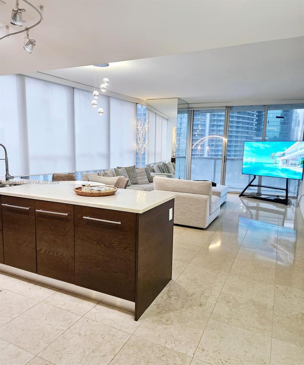 Stunning 2-Bedroom, 2-Bathroom  Furnished Luxury Condo for Rent at Icon Brickell Tower I This beautifully furnished corner residence offers 2 bedrooms and 2 bathrooms, thoughtfully designed to combine comfort, style, and functionality.Positioned to maximize natural light, the unit features floor-to-ceiling windows with multiple exposures, framing serene views of the Miami River and the passing boats below. The open-concept layout creates a seamless flow between living and dining areas, making the space feel both expansive and inviting.Offered fully furnished and turnkey, the interiors are curated with high-quality pieces that elevate everyday living while allowing for effortless entertaining.The corner positioning provides an added sense  brightness an element that truly sets this residence apart.Residents of Icon Brickell enjoy access to world-class amenities and one of the most desirable locations in Brickell, just moments from the city’s top dining, shopping, and waterfront experiences.A refined and well-appointed home in one of Miami’s most recognized addresses.