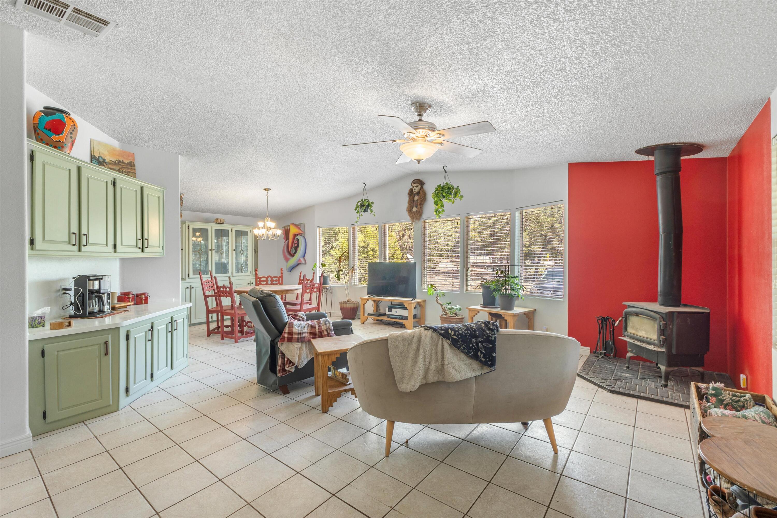 Tucked away on 4 private acres (two distinct two-acre lots), this property offers the space, views, and flexibility that are getting harder to find. The home features 3 bedrooms, a spacious layout, and a large living area anchored by a bay window that frames the surrounding landscape.  The kitchen is designed for real use with plenty of storage, generous counter space, and room to gather. The primary suite includes a new spacious corner tub, separate shower, and room to unwind.  Many recent updates, including windows, bathrooms, kitchen and more!  Outside is where this property really delivers. Multiple sheds open the door for hobbies, storage, or workspace needs, with plenty of additional land to expand, garden, or simply enjoy the privacy.  Septic replaced in 2019.