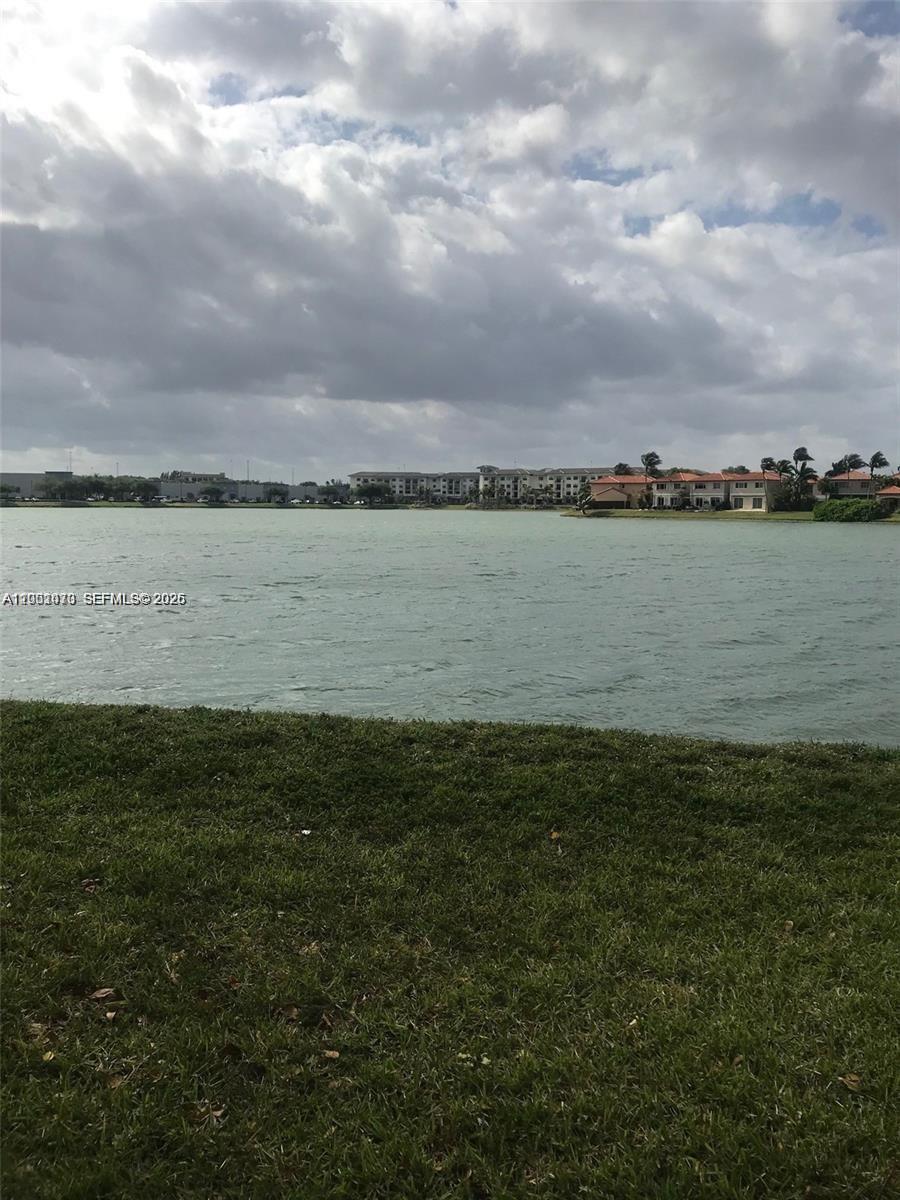 Spacious living room with panoramic views at 14621 Balgowan Rd - Townhouse in Miami Lakes