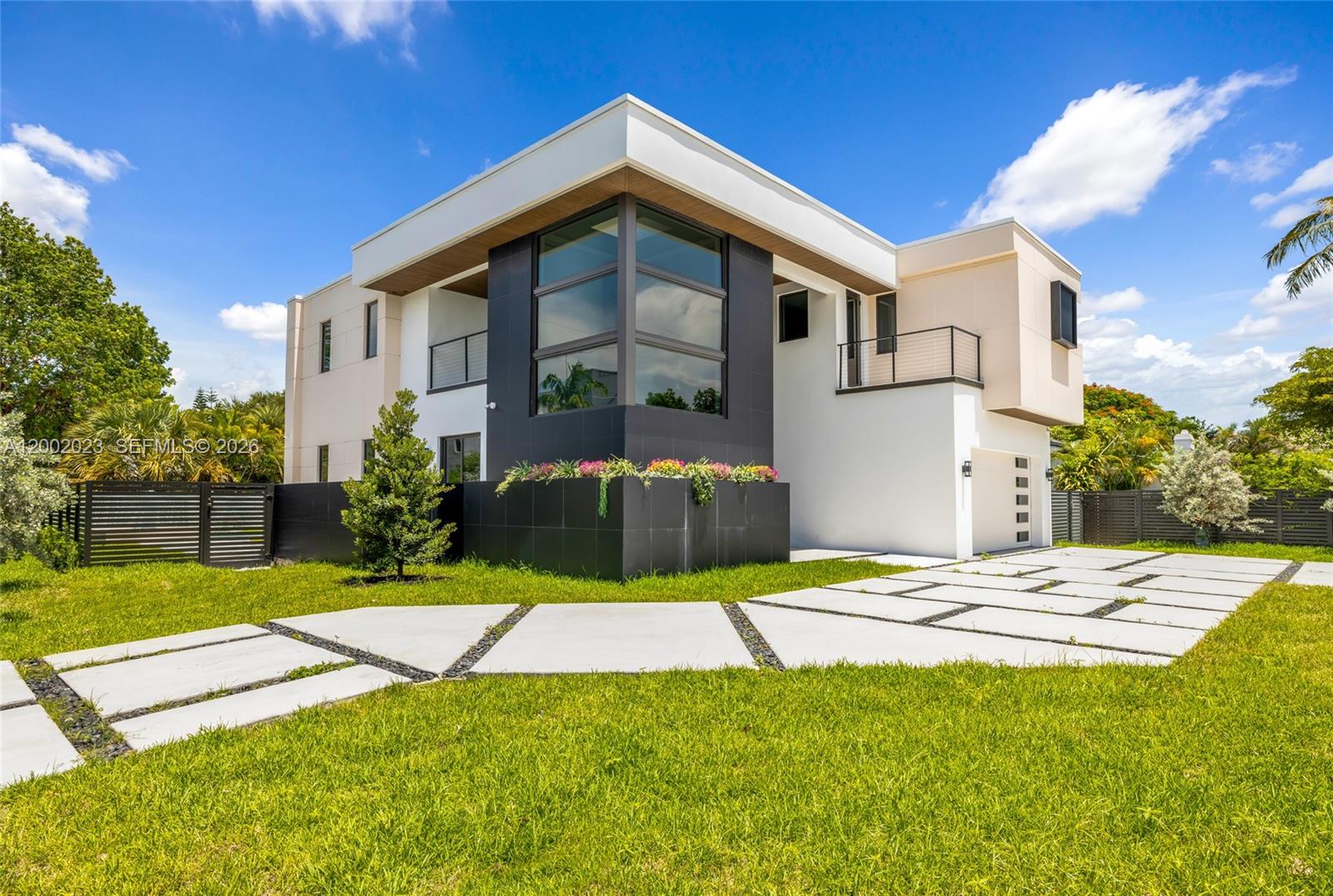 Spectacular brand-new construction offering 3,531 sq ft of refined living and 5,224 sq ft total in Victoria Park. This 5-bed /4.5-bath modern estate features a glass bridge connecting both wings, soaring ceilings, polished porcelain floors, and floor-to-ceiling impact glass. Gourmet kitchen with custom cabinetry, quartz waterfall counters, premium Jen Air appliances, and Liebherr wine fridge. Spacious master suite with oversized walk-in closet and spa-style bath. First-floor office opens to a private “secret garden” balcony. Backyard oasis boasts a pool with a jacuzzi and waterfall, lush landscaping, and covered patio. Two skylights, floating stairway, butler pantry, and dimmable lighting throughout complete this exceptional residence designed for elevated living.